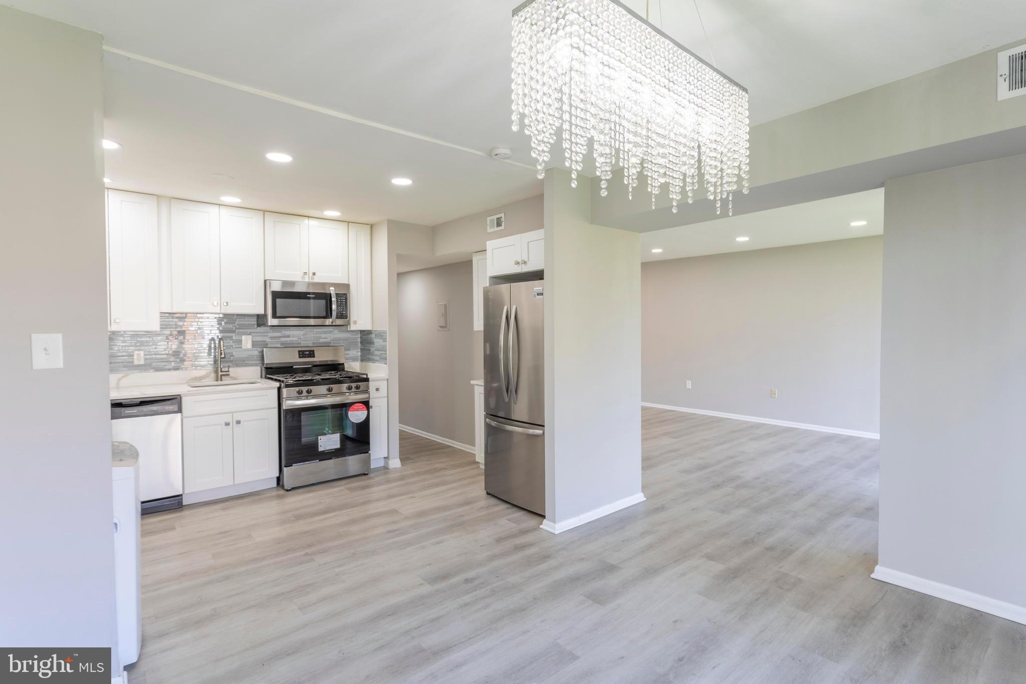 Amazing opportunity to live in a fully updated 2 bedroom 1 bathroom condo unit located within the Chelsea Woods community.  Beautifully positioned amongst the trees, this unit offers large windows overlooking the serene foliage. Upon entering the unit, light streams into each room illuminating the modern updates. Freshly painted walls and upgraded LVP lead you into the living space complete with a balcony, where you can perfectly enjoy your wooded surroundings on a beautiful day. The living room flows seamlessly into the shared dining and kitchen space. Appointed with new cabinetry, fixtures, and appliances, this kitchen space is perfect for those who like to cook.  The updated bathroom and spacious bedrooms make for the perfect living space in proximity to major commuter roads. to make travel to DC, College Park, and NASA Goddard! Schedule your tour today!