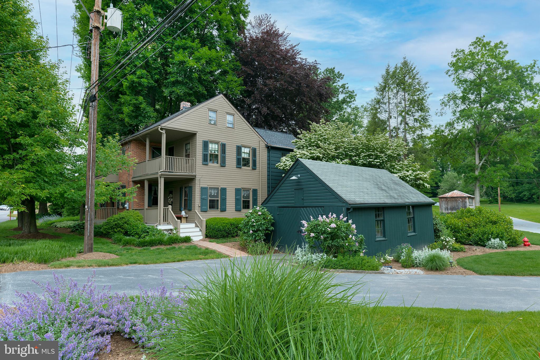 Wow... just wow!!!  Charming Historic farmhouse with so much character and custom woodwork throughout.  You'll love the plush landscaping.  Large custom eat-in kitchen with Leathered granite countertops, farm sink, and all appliances.  Dining room with exposed wooden beams.  Large living room plus 1st floor family room with wood burning fireplace.  4 bedrooms. 2.5 baths, Shiplap primary bathroom is vaulted.  This 1st floor powder room is amazing with the wooden door and copper sink from Lancaster's candy factory.  Owner's suite with barn door, balcony, and walk-in closet.  2nd floor laundry with front load washer and dryer.  Hardwood floors throughout.  New central air.  Detached garage.  Home is in a flood zone but has never flooded since this owner.  Flood insurance is required.  This home is amazing!!!