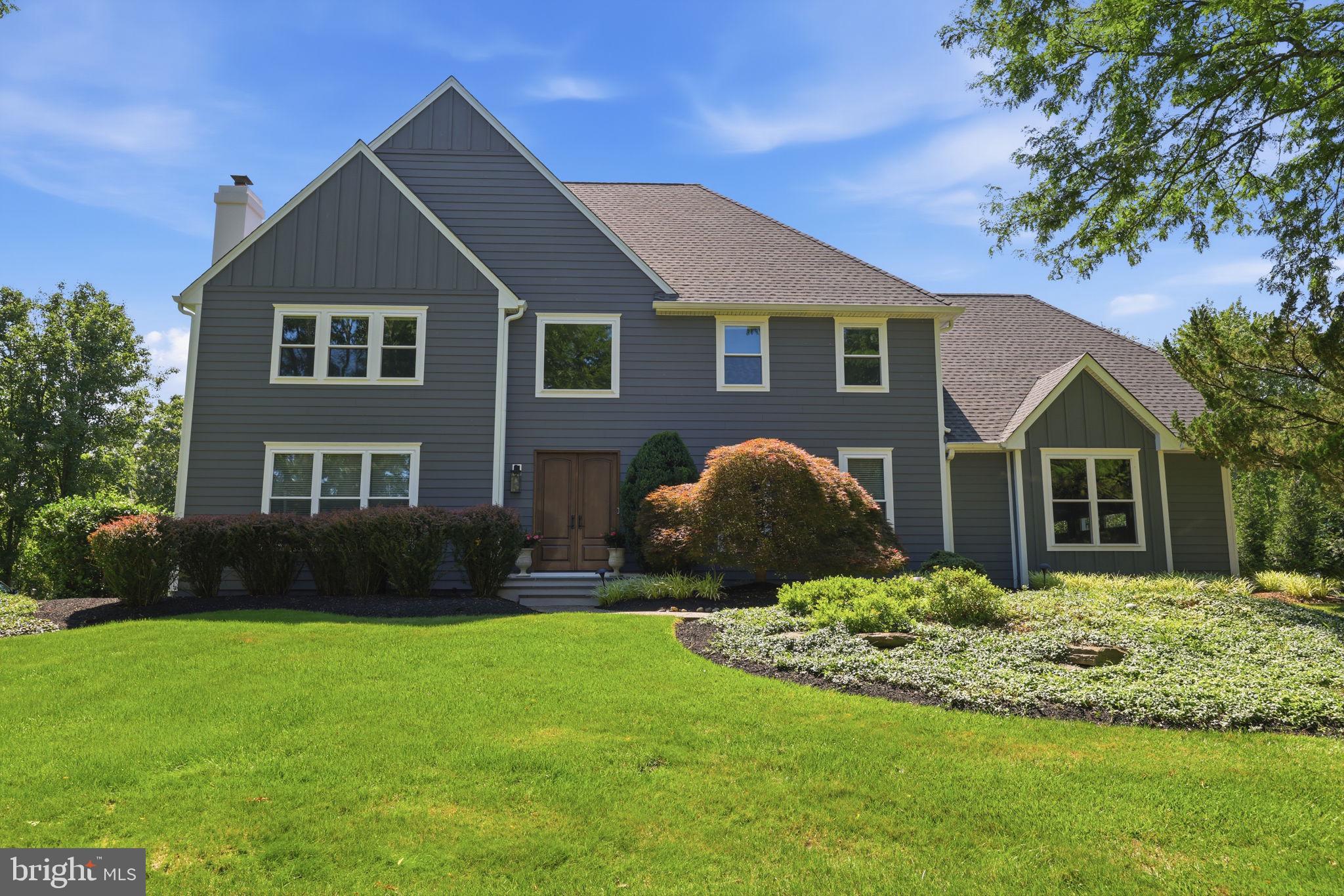 Exceptional craftsmanship, thoughtful updates, timeless elegance, and energy-efficient living define this impressive Lower Makefield Township residence. Meticulously maintained and extensively improved, this home offers outstanding curb appeal with Hardi Plank siding, Azek trim, replacement windows, doors, garage doors, gutters, and downspouts—all completed within the past three years. The roof was replaced just four years ago and is complemented by roof-mounted solar panels, providing an outstanding energy-efficient feature and the potential for significant long-term utility savings. Handsome bluestone front entry steps complete the striking first impression.

Inside, a gracious floor plan is designed for both everyday living and entertaining. The dramatic family room features a floor-to-ceiling stone fireplace and opens directly to a beautiful rear paver patio. The gourmet center island kitchen is appointed with Sub-Zero refrigeration, GE Profile range and oven, abundant cabinetry, and flows seamlessly into the bright breakfast room with vaulted ceiling and skylights.

Just beyond, the spectacular sunroom offers a cathedral ceiling, skylights, tile flooring, and direct access to the patio, creating the perfect space to relax year-round. A private first-floor study with French doors provides an ideal home office or library, while the finished lower level significantly expands the home's living space for recreation, fitness, media, or hobbies.

Step outside to enjoy one of this property's most exceptional features—a private rear yard that backs directly to Lower Makefield Township open space, providing peaceful wooded views, outstanding privacy, and a protected natural backdrop that enhances the beauty and tranquility of the property.

Additional amenities include:

Solar panel system 
8-zone sprinkler irrigation system
Central vacuum system
EV charging station
Beautiful rear paver patio for outdoor entertaining

Situated in highly desirable Lower Makefield Township with convenient access to I-95, this exceptional home offers an ideal location for commuting to Princeton, Philadelphia, and New York City while enjoying one of Bucks County's premier communities.

Beautifully updated inside and out, this remarkable property combines luxury finishes, extensive recent improvements, energy-efficient amenities, and an irreplaceable open-space setting to create a truly exceptional place to call home.