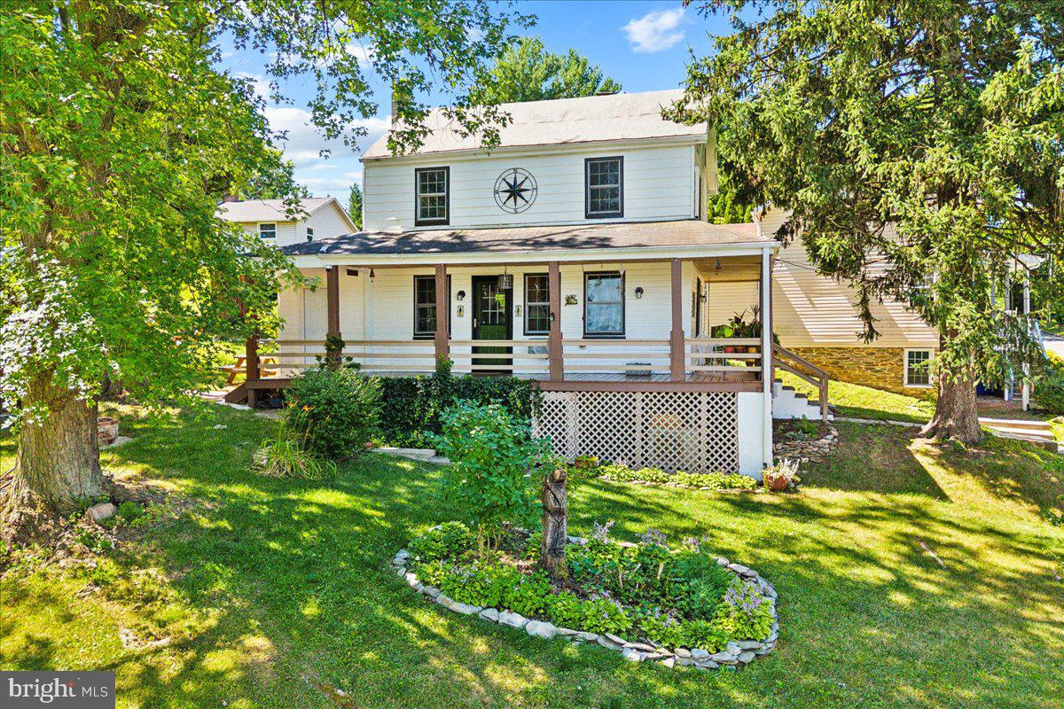 Travel back in time with this adorable, circa 1800's, renovated in 2013 farmhouse that oozes with historic charm and evokes feelings of living in a much simpler, by-gone era but also affords the comfort and conveniences one would expect in a more modern home!

Located just minutes to 1-70/1-270 and seven miles to downtown Frederick, MD for an easy commute to work this quaint, suburban home is within walking distance to the charming, historic of downtown Middletown, MD and all of the amazing amenities! 

This cozy 2 bedrooms, 2 full baths, has so much to offer! Such  as a bonus area/home office located on the 2nd level! An eat-in kitchen/dining area, family room and an adjacent laundry/storage room just off the kitchen with a separate entrance on the main level. 

The just over 1/3 of an acre lot offers gobs of off-street parking for multiple vehicles and is free of any HOA! 
This adorable lot also has an outbuilding with electric that can be used as additional storage or a workshop and an additional cabana/party hut that offers a covered, out-door area for setting up your grill and entertaining family and friends. 

City water/sewer is provided by the town allowing for no worries with well water/septic tank systems keeping you up at night! Wrapped in vinyl/aluminum siding, ½ wrap around covered porch and topped by a metal roof provides for very low upkeep. Upgraded thermal windows and doors and a combination Mitsubishi mini-split, ductless HVAC system with oil furnace heat back-up installed in 2021 offers comfortable efficient heating/cooling in the coldest of winter nights and the hottest summer days. 

Walk the kids to school in the morning and stop into the Main Cup, visit with neighbors and treat yourself to a delicious cup of locally renowned coffee!  On the way back home take a leisurely stroll down the paved walking paths to see what's growing at the local, community garden or maybe even go for a swim in the crystal clear, running waters of Catoctin Creek. 

This cozy, home is perfect for a first time home buyer or someone just starting out but also offers an investor/expansion opportunity with an adjoining,  ½ acre lot also being offered for sale as a package or can be purchased separately. MLS #MDFR2050252.  Both lots are zoned R-2 and can accommodate 2 multifamily dwellings. You can live in the current home while you build your dream home/investment properties next door. The sky is the limit for a buyer with vision! Buyers must do their own due diligence.  Schedule your showing on this one of a kind property today!