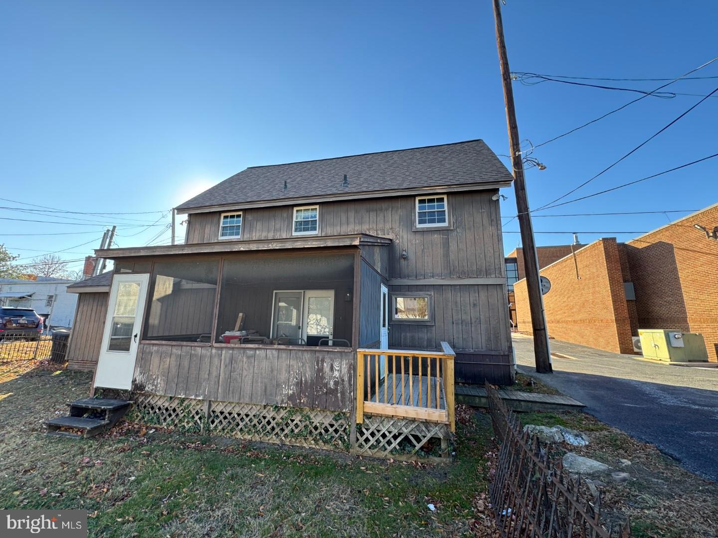 Delightful little converted barn located off of Bradford Street. Screened porch, carport, two bedrooms upstairs, living, dining, utility rooms and kitchen downstairs. All public utilities. A bath and a half. Quiet and charming.