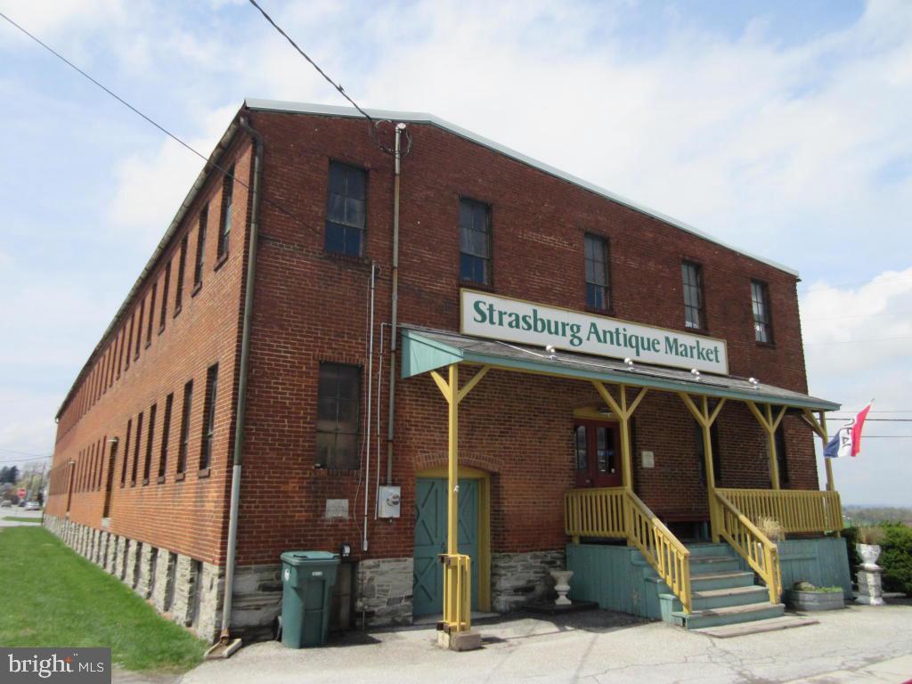 Fabulous opportunity...An amazing & lovely 10,000+ S.F. all brick building on 1 acre in a great tourist area in the heart of Strasburg, Lancaster County.   Two large floors plus a huge basement with daylight windows.  Drenched with natural light throughout; Huge owners apartment on 2nd floor with nice kitchen/Original woodwork, exposed brick, wood doors & arched doorways...Absolutely lovely!