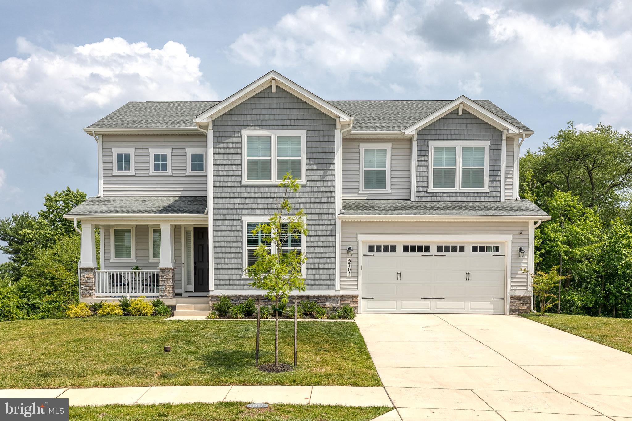 Exceptional Properties. Exceptional Clients. Welcome to 5701 Charlies Way, a stunning newer built home located in the highly desirable, tucked away, Vincent Estates community of White Marsh. This beautifully designed Presley model by Richmond American Homes is ready for you to move in and offers the perfect blend of modern luxury, thoughtful design, and everyday comfort on a private half-acre lot. From the moment you arrive, you’ll be greeted by a welcoming covered front porch and an impressive two-story entry that sets the tone for this exceptional home. The main level features a dedicated study, an expansive great room filled with natural light from added windows with custom window treatments, and a cozy electric fireplace that creates the perfect gathering space. The heart of the home is the gourmet kitchen, featuring an over-sized island, quartz counter tops, premium finishes, a walk-in pantry, and plenty of space for entertaining. Luxury vinyl flooring, open oak stairs, and stylish design selections flow throughout the home, creating a warm and contemporary feel. A convenient main-floor powder room, and a large garage that is big enough for 3 cars featuring a fresh epoxy floor  completes the first level. Upstairs, you’ll find a spacious laundry room with sink, along with a luxurious primary suite designed for relaxation. The owner’s retreat includes additional windows, an over-sized walk-in closet, and a spa-like deluxe bathroom with a walk-in shower. Two additional top floor bedrooms and a full bath with double sinks provide plenty of space for family, guests, or flexible living needs. The top floor also features a spacious additional living area or recreation room, offering the perfect spot for a media room, playroom, home office, or additional gathering space. The finished basement expands the living space even further with a recreation or media room, an additional bedroom, a full bathroom, and a large lower-level living area—ideal for guests, entertaining, or a private retreat. Set on a peaceful half-acre private lot in the newly built Vincent Estates community, this home offers room to enjoy the outdoors while still being conveniently located near everything White Marsh has to offer. Enjoy easy access to dining, shopping, and entertainment at The Avenue at White Marsh and White Marsh Mall, as well as convenient access to 43 and 95, all just minutes away. This exceptional home combines new construction convenience, upscale finishes, abundant living space, and a beautiful yard—making 5701 Charlies Way the dream home you’ve been waiting for.