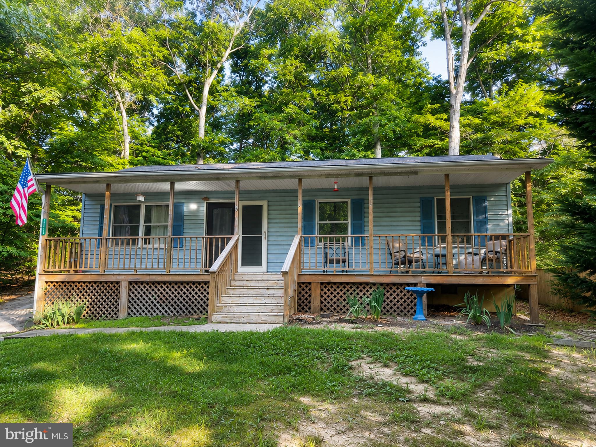 Adorable 3 bedroom 1 bathroom rambler nestled on a peaceful wooded lot! This inviting home features a welcoming covered front porch, an open-concept floor plan, and durable  vinyl plank flooring throughout the main living areas. Major improvements include a roof approximately 10 years old, an HVAC system approximately 6 years old, and some updates to the kitchen and bathroom. While the home could benefit from a little TLC, it offers incredible potential for first-time buyers, investors, or anyone looking to build instant sweat equity. Enjoy the privacy of the surrounding trees while still being conveniently located to shopping, dining, schools, and commuter routes. Bring your vision and make this charming rambler your own!