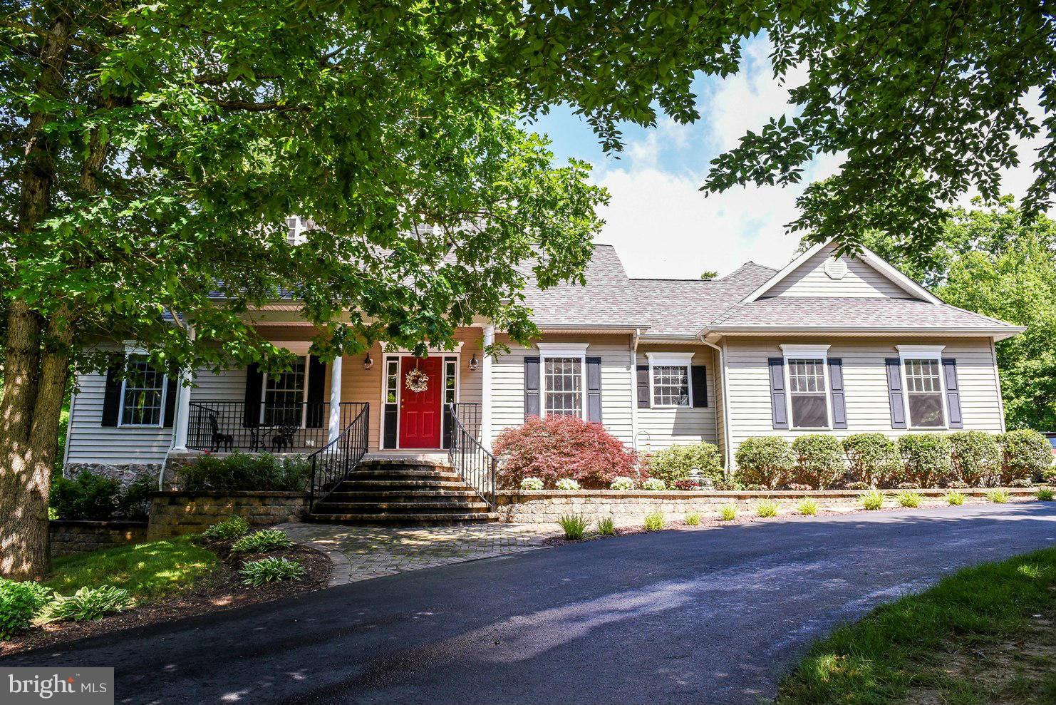 What a beauty! First floor living with finished basement for overflow. Corian counters, 9' ceilings in most, tray ceilings in others, upgraded lighting-all the pops and whistles. Outside space seals the deal-fenced yard, deck and lower level patio. Spectacular stone work, pavers and retaining walls run front to back highlighting the beautifully landscaped yard. Absolute pride in ownership!!