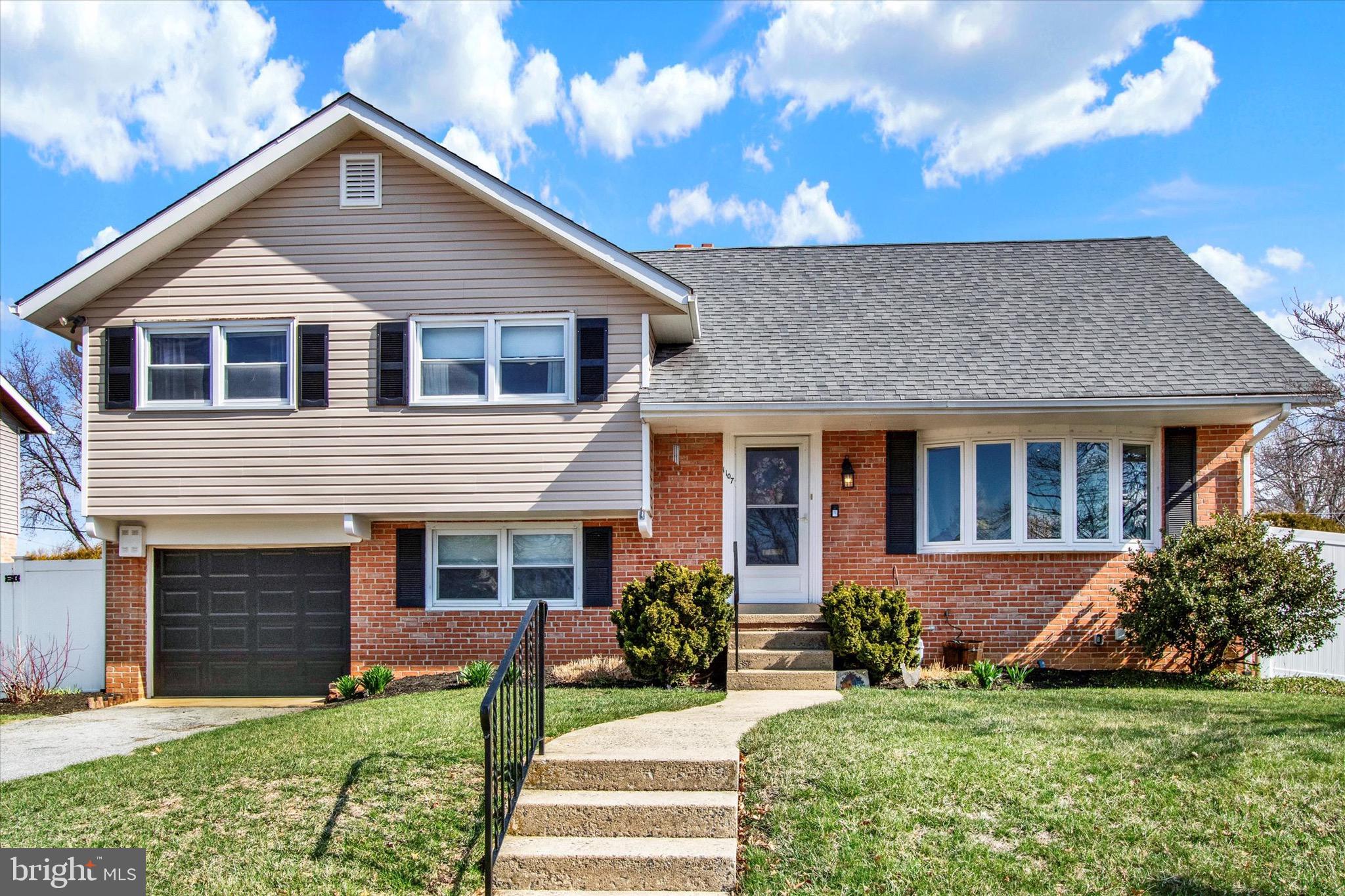 Here it is! A beautiful 4 bedroom, 2 bath split-level in the highly desired subdivision of Whitfield, and of course, in Wilson School District! This clean, well-maintained home has great curb appeal in the front, and a large, level yard in the back, complete with white vinyl privacy fence. Inside, past the tiled entryway, the spacious living room has neutral paint, recessed lighting, a large bow window, and oak hardwood floors that lead into the formal dining room, which boasts both chair rail and crown molding. Next, the kitchen has been nicely updated with stainless steel appliances and additional cabinetry for a pantry and coffee bar, and you will love the double window over the sink looking out into the yard! Upstairs on the next level, you will find 3 bedrooms and a full bathroom, and up another level there is a large 4th bedroom with a sitting room area. Downstairs, there is an awesome family room with a brick wood-burning fireplace, and a second full bathroom. This room also has access to the garage, and to the backyard patio. Down one more level, you will find the basement with plenty of storage. Other notable features of this great home include: a newer roof (2014), attic fan (2017), new bow window in living room (2019), new fence (2020), new HVAC with air purification system (2024), new garage window (2025), a 1-car attached garage, and extra off-street parking beside the driveway. Set up your showing today! One Year home warranty included!