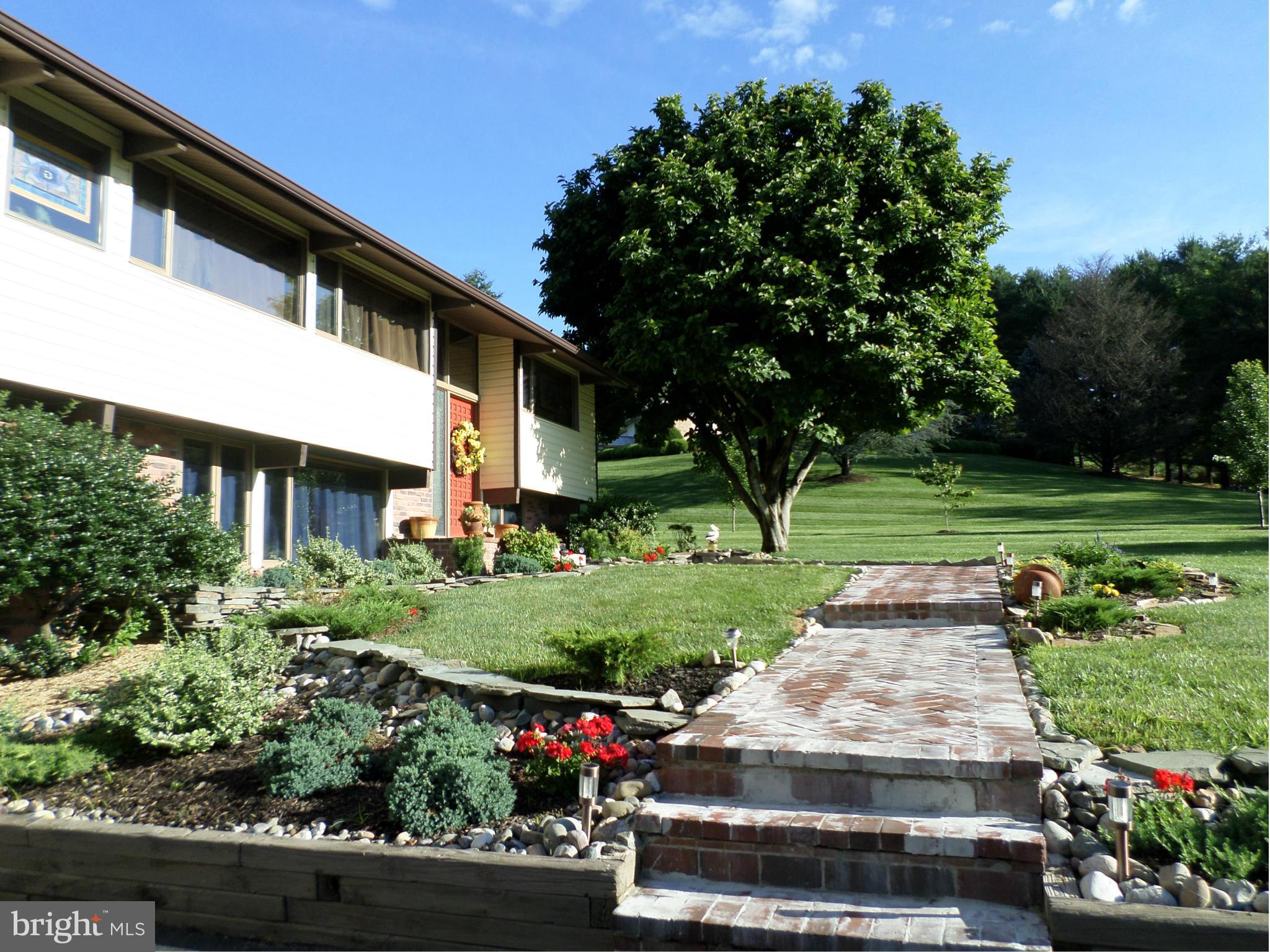 RETREAT STYLE CONTEMP W/WARM WOOD VAULTED CEILINGS, LOADS OF LITE & OPEN FLR PLAN* HRDWD FLRS* GREAT ROOM W/FP* FRENCH DOORS LEAD TO 33X12 DECK TO ENJOY AWESOME VIEWS OF BELFAST VALLEY* UPGRADED KITCHEN/DINING COMBO W/CUSTOM PANTRY CABINETS* 2 MASTER SUITES W/UPGRADED BATHS ON MAIN LEVEL* LL FEATURES FAMRM W/PELLET STOVE, 2 BEDROOMS W/FULL BATH* STAMPED CONCRETE PATIO W/HOT TUB* CUSTOM LANDSCAPING