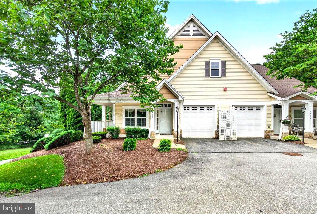 This lovely 62+ community features attractive architecture, convenient location and beautiful surroundings. The condo offers single level living with an open floorplan, high ceilings and two spacious bedrooms both with attached baths and plenty of closet space.  The kitchen features granite countertops, updated appliances and a large island that's perfect for entertaining guests. Ground level entry with no units above. Relaxing, covered front porch and side balcony are perfect for enjoying the outdoors. Finished attached garage, private driveway and guest parking available.