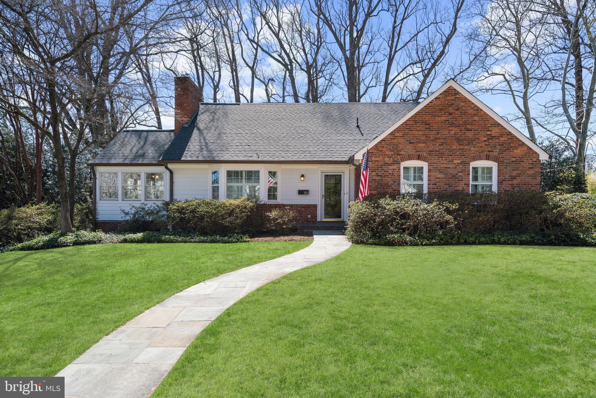 Introducing 5112 Scarsdale Rd — a classic brick Williamsburg-style Colonial set on an expansive 12,000-square-foot lot, offering over 3,500 square feet of beautifully finished living space designed for both everyday comfort and effortless entertaining. A welcoming foyer opens to sun-drenched interiors accented by hardwood floors throughout. The gracious living room, anchored by a fireplace, flows seamlessly into the formal dining room, creating an ideal setting for gatherings both intimate and grand. At the heart of the home, the gourmet eat-in kitchen features stainless steel appliances, granite countertops, a center island, ample cabinetry, and a charming breakfast alcove bathed in natural light. Just beyond, the sunroom provides exceptional flexibility as a family room or playroom, with direct access to the expansive deck overlooking the flat, private backyard — perfect for indoor-outdoor living. The main level offers three bedrooms and a full bath, providing versatility for guests, a home office, or multigenerational living, along with a convenient powder room for visitors. 
Upstairs, the spacious primary suite includes multiple closets including a walk-in closet, while an additional bedroom and hall bath complete the upper level. The walk-out lower level expands the home’s livability with a large family room, kitchenette, additional bedroom, full bath, gym, and laundry area — ideal for guests, an au pair suite, or recreation space. An attached two-car garage adds everyday convenience to this timeless and thoughtfully designed home. Ideally located in the sought-after Sumner neighborhood, residents enjoy a quiet, tree-lined setting just moments from the shops and dining of nearby commercial corridors, neighborhood parks, and easy commuter routes into downtown Washington. 5112 Scarsdale offers the rare combination of classic architecture, generous lot size, and an exceptional location in one of the area’s most established and desirable communities.