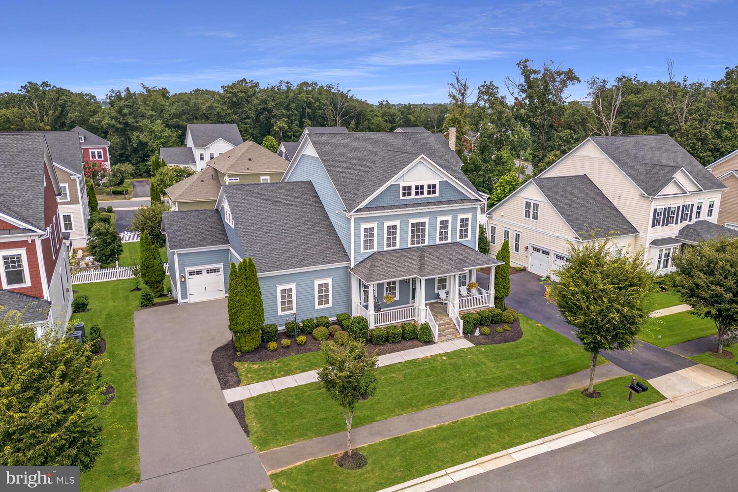 Discover the perfect blend of luxury, comfort, and timeless design in this stunning Devonshire model by K. Hovnanian, ideally located in The Grange at Willowsford. From the inviting front porch to the thoughtfully designed walkout basement, every inch of this home is crafted for refined living and effortless entertaining.
<br><br>
Inside, a gracious foyer sets the tone, flanked by formal living and dining rooms adorned with intricate moldings and wide plank hardwood floors. At the heart of the home, the gourmet kitchen is a true showpiece—where form meets function in the most beautiful way. Designed for both everyday living and seamless entertaining, it features an oversized center island that provides abundant prep space, casual dining, and gathering room for friends and family. Granite countertops, a custom mosaic tile backsplash, and rich cabinetry combine for a timeless aesthetic, while high-end stainless steel appliances—including a top-of-the-line Viking range hood and gas cooktop—elevate the culinary experience. The adjoining breakfast room opens directly to the deck, creating an easy transition to outdoor dining and relaxation.
<br><br>
The open-concept family room provides a warm and inviting atmosphere, centered around a cozy gas fireplace and seamlessly connected to the kitchen—perfect for everyday living and entertaining. Just off the main living area, a private home office is thoughtfully tucked away, creating a quiet and productive retreat for work or study.
<br><br>
Upstairs, the expansive primary suite is a luxurious retreat, featuring plush carpeting, two walk-in closets, and a spa-inspired bath with a soaking tub, dual vanities, and a frameless glass walk-in shower. Three additional bedrooms offer generous accommodations—one with a private en-suite bath, and two that share a well-appointed Jack and Jill bathroom. The laundry room is conveniently located on the bedroom level.
<br><br>
The fully finished walkout basement extends the living space with remarkable versatility. It includes a spacious recreation room, dedicated media room, exercise room, and a fifth bedroom with a full bath—perfect for overnight guests or multigenerational living.
<br><br>
Step outside to a beautifully landscaped backyard oasis featuring multiple patios and a Trex deck with pergola, providing an ideal setting for outdoor entertaining or peaceful evenings under the stars. A side-load three-car garage adds functionality and curb appeal.
<br><br>
All of this is complemented by Willowsford’s unparalleled lifestyle amenities, including resort-style pools, state-of-the-art fitness centers, miles of scenic trails, community parks, and a vibrant calendar of events. Residents also enjoy the farm-to-table experience curated by the Willowsford Farm and Conservancy, making this award-winning neighborhood a truly one-of-a-kind place to call home.