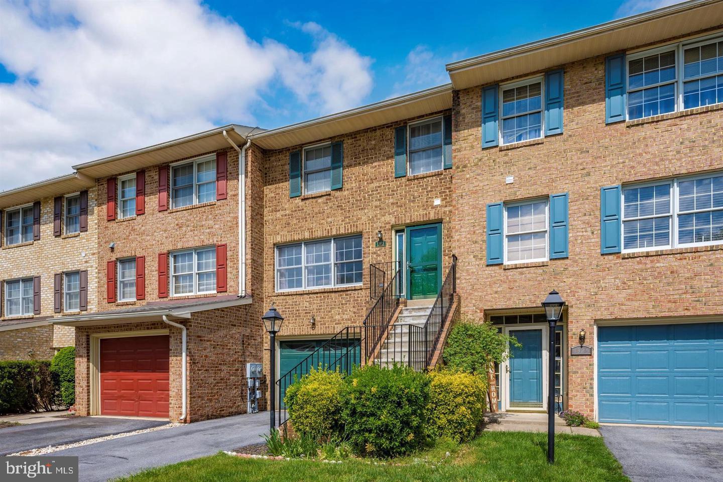 OPEN HOUSE SUNDAY FROM 12:30 TO 3:30 PM .   Come and see - you won't  be disappointed!   This beautiful brick townhome with 3 finished levels has plenty of natural light and in a community full of amenities plus  a great location.  You will find 3 spacious bedrooms on the second level with 2 full bathrooms.  The main level has your living room, dining area, fireplace, a beautiful kitchen with stainless steel appliances, a half bath and, for your enjoyment, access to a very nice deck.  Also, there is a finished and large walk-out basement  with a full bathroom.   From the basement you can go out and enjoy a nice backyard.  And, to top it off, you have a spacious attached garage and driveway.  This community has many amenities to offer like a swimming pool, tennis courts, tot lots/playground, club house and more.  Don't let this one pass you by!
