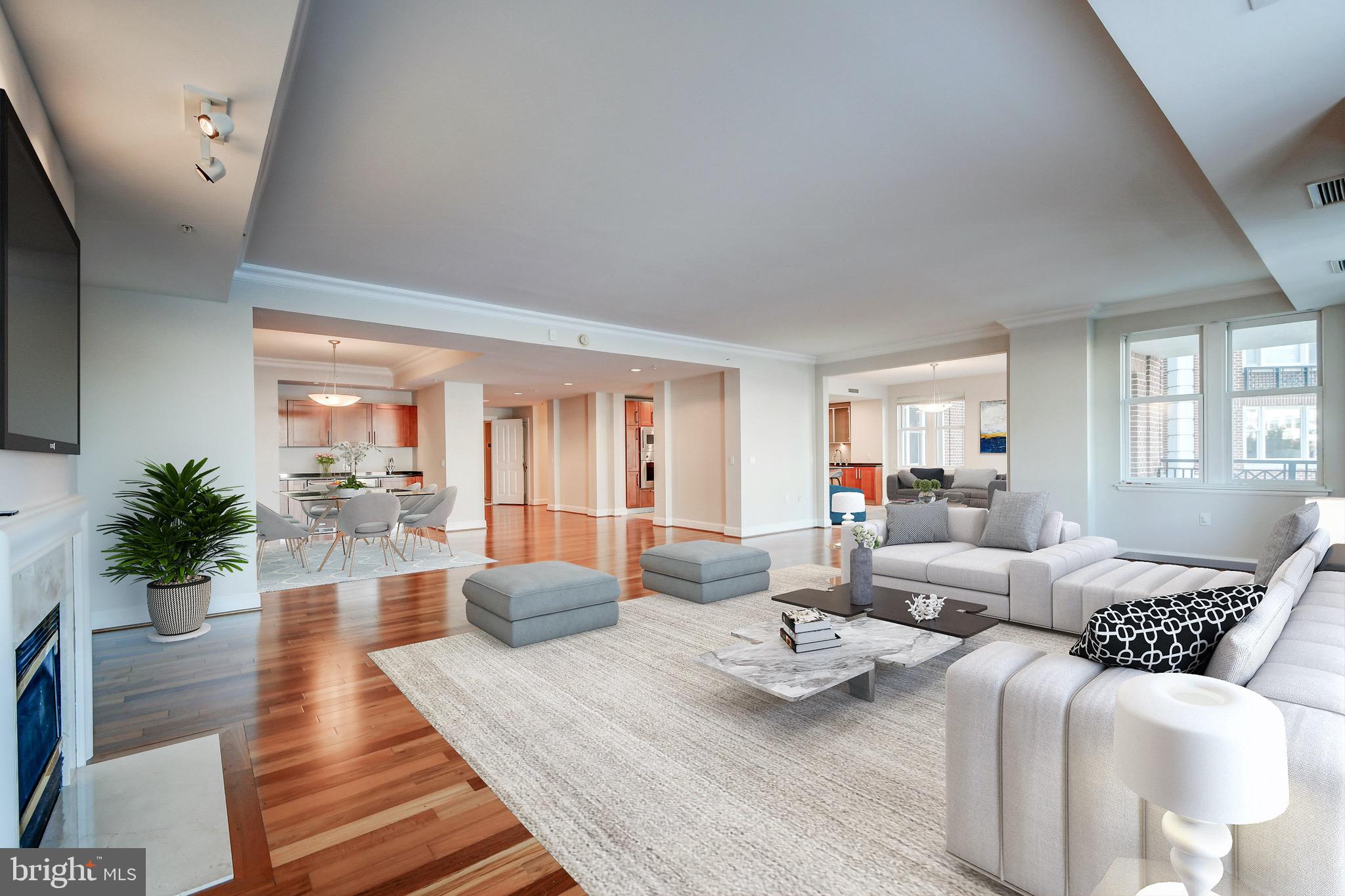 One of the largest waterfront condominiums in Baltimore ! This spectacular 3 bedroom 4.5 bath boasts over 4100 sq ft of the ultimate in luxury.  The wide open floorplan provides a unique opportunity to entertain on a grand scale.   The corner location offers incomparable views of The Inner Harbor, city skyline, Harbor East and Fells Point.  Sit and watch the boats go by from the comfort of your fabulously appointed home, or enjoy the weather from one of the two large waterfront corner terraces.  The Asian Teak hardwood flooring runs throughout the living areas and is complemented by marble baths and newly installed low profile carpet in all three bedrooms and media room.  All bedrooms are en-suite as is the dedicated media room with its own full private bath.  The owner's suite is sure to please even the most discerning buyer with its fabulous waterfront views, large walk-in closet, enormous master bath with soaking tub shower and bidet.    This tremendous residence is only the beginning of your new journey.  As a resident of The Residences at The Ritz-Carlton, you will enjoy a world class five star lifestyle 365 days a year.  From the moment you enter the  porte-cochère - you will be greeted by the valet and doorman.  Complementary valet parking is available to residents as well as their guests. Once inside the marble lobby, the Ritz-Carlton trained concierge will be at your service 24 hours a day for assistance with packages, lodging, travel, transportation, travel and any other service you may require.  In addition to the well appointed lobby, the property offers a resident lounge, game and billiard room, board room, private theater, indoor pool with hot tub and saunas and 24/7 state of the art fitness center.  The two acres of waterfront gardens allow you to enjoy a little nature - in the heart of the city, along it's amazing waterfront.  This residence has it all.