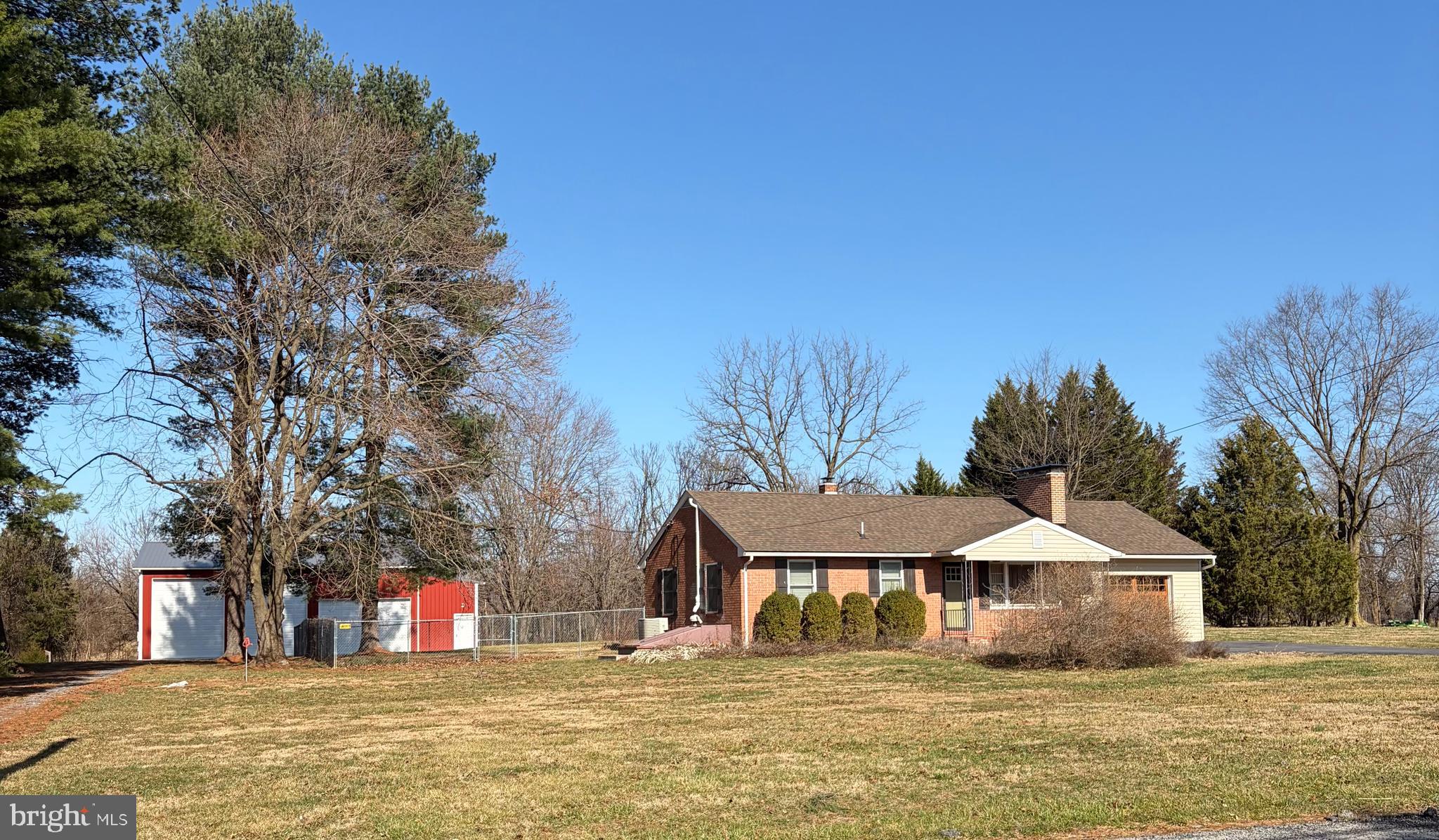 Back on the market with a price improvement. Our loss is your gain! Welcome to this beautifully maintained all-brick rancher situated on a picturesque one-acre lot surrounded by pastoral and mountain views. Offering two bedrooms and one full bath, this home provides comfortable single-level living in a peaceful rural setting while still being conveniently located.
Step outside and discover the property’s standout feature—an impressive, recently built 30' x 48' x 16' top-of-the-line pole barn. Perfect for hobbyists, contractors, car enthusiasts, or RV owners, this structure includes: separate underground electric service, fully insulated interior, epoxy-coated concrete floors, two mini splits to condition the space, four overhead garage doors with remotes for easy access and a dedicated office space. You are sure to be impressed, Additional exterior features add even more value, including an RV dump station with water supply, rear chain link fencing, and a storage shed that conveys with a riding lawn mower.  Enjoy peaceful mornings and quiet evenings surrounded by serene landscapes, open skies, and the tranquility of country living. This property combines charm, functionality, and privacy—a rare find in a truly serene location.  Close to the ammenities of Shepherdstown, you will find downtown Shepherdstown feels like stepping into a well-kept 18th-century village. Most of the buildings are historic, and everything is close together, so you can park once and explore on foot. Expect unique  storefronts and lots of preserved architecture. You can wander without a plan and enjoy all the town has to offer. Most cafés, shops, and restaurants are within a 5-minute stroll of each other. The town feels peaceful and lived-in — not touristy or commercial.P op into a local book store with character, find handmade crafts and local art, antiques and vintage treasures, outdoor and bike shops, cozy gift shops and specialty stores. It’s the kind of town where you walk into a store and end up chatting with the owner. If this sounds like something you are looking for, schedule your showing today and make this your home.