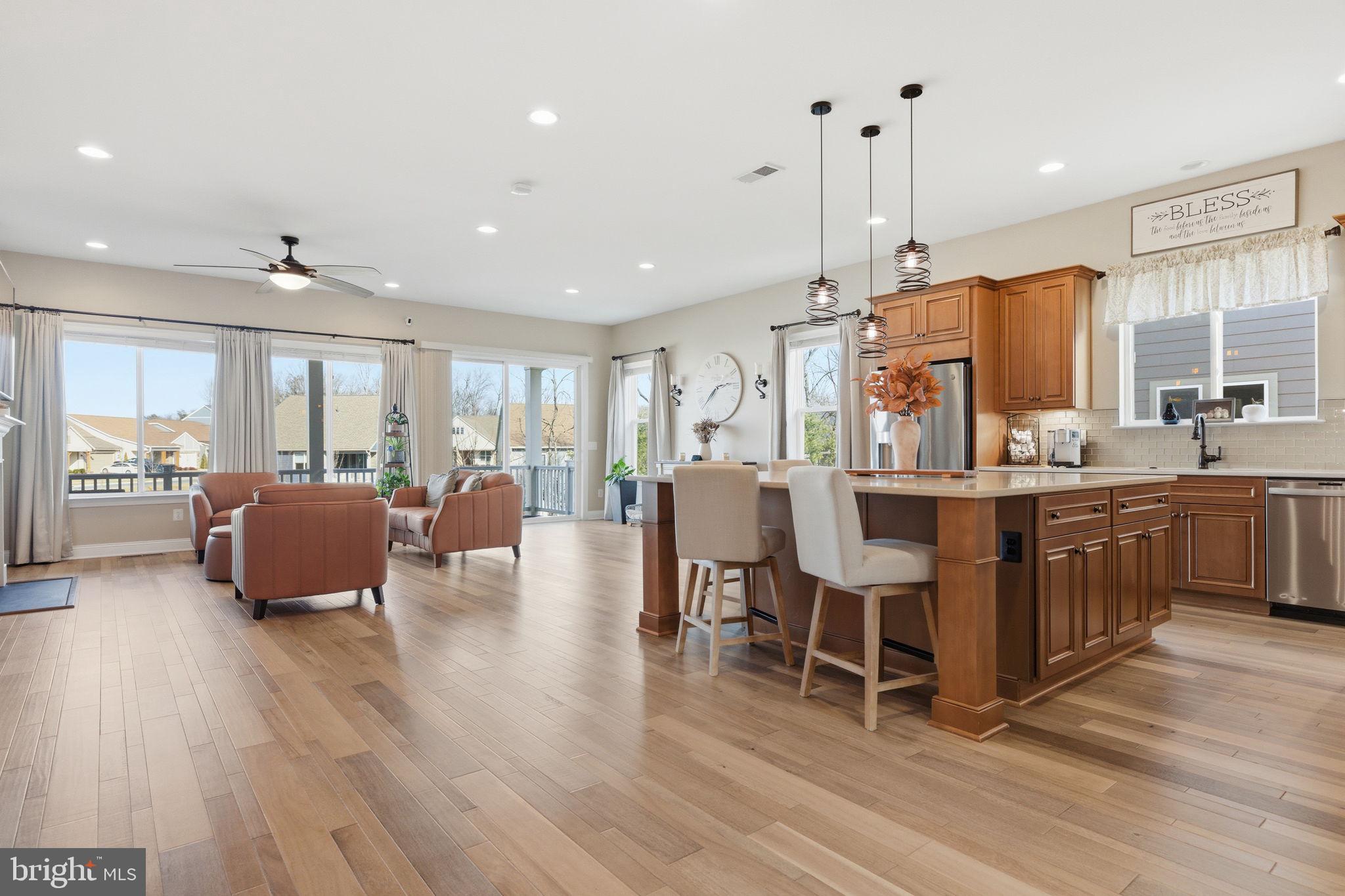 Some homes feel impressive the moment you walk in. This one keeps that feeling going. From the sun-filled main level to the finished lower level designed for entertaining, 117 Pintail Way feels less like a downsize and more like a lifestyle upgrade.<br>Built in 2021 in Trilogy at Lake Frederick, this Shea Evoke model has the polished, model-home feel buyers love, with a layout that lives beautifully day to day. The main level is open, warm, and easy to move through, with wide-plank flooring, generous natural light, and connected spaces for cooking, dining, relaxing, and hosting.<br>The kitchen sits at the center of it all, with rich cabinetry, an oversized island with seating, stylish lighting, and a layout that naturally draws people in. The great room is anchored by a striking stone fireplace, while large windows and doors connect the indoors to the expansive covered patio.<br>Stretching nearly 50 feet across the rear of the home, the covered patio feels like an outdoor living room with space for morning coffee, casual dinners, evening drinks, or a cool drink after pickleball with friends.<br>The main level lives beautifully with a spacious primary suite, a second bedroom with an ensuite bath, plus a third bedroom and additional full bath. A flex space adds versatility for a private office, den, hobby room, or guest space.<br>Downstairs brings a completely different kind of energy. With a spacious recreation area, custom bar with stone accent wall and open shelving, additional bedroom, full bath, workshop, and craft area, the lower level is ready for game nights, movie nights, visiting family, or friends gathered around the bar.<br>Lawn maintenance is handled by the HOA, leaving more time for the lake, trails, clubs, dining, fitness, pickleball, social events, and resort-style amenities that make Trilogy at Lake Frederick so desirable.<br>Move-in ready, beautifully finished, and designed for the way people actually want to live, this is a Lake Frederick home that makes the next chapter feel wide open.