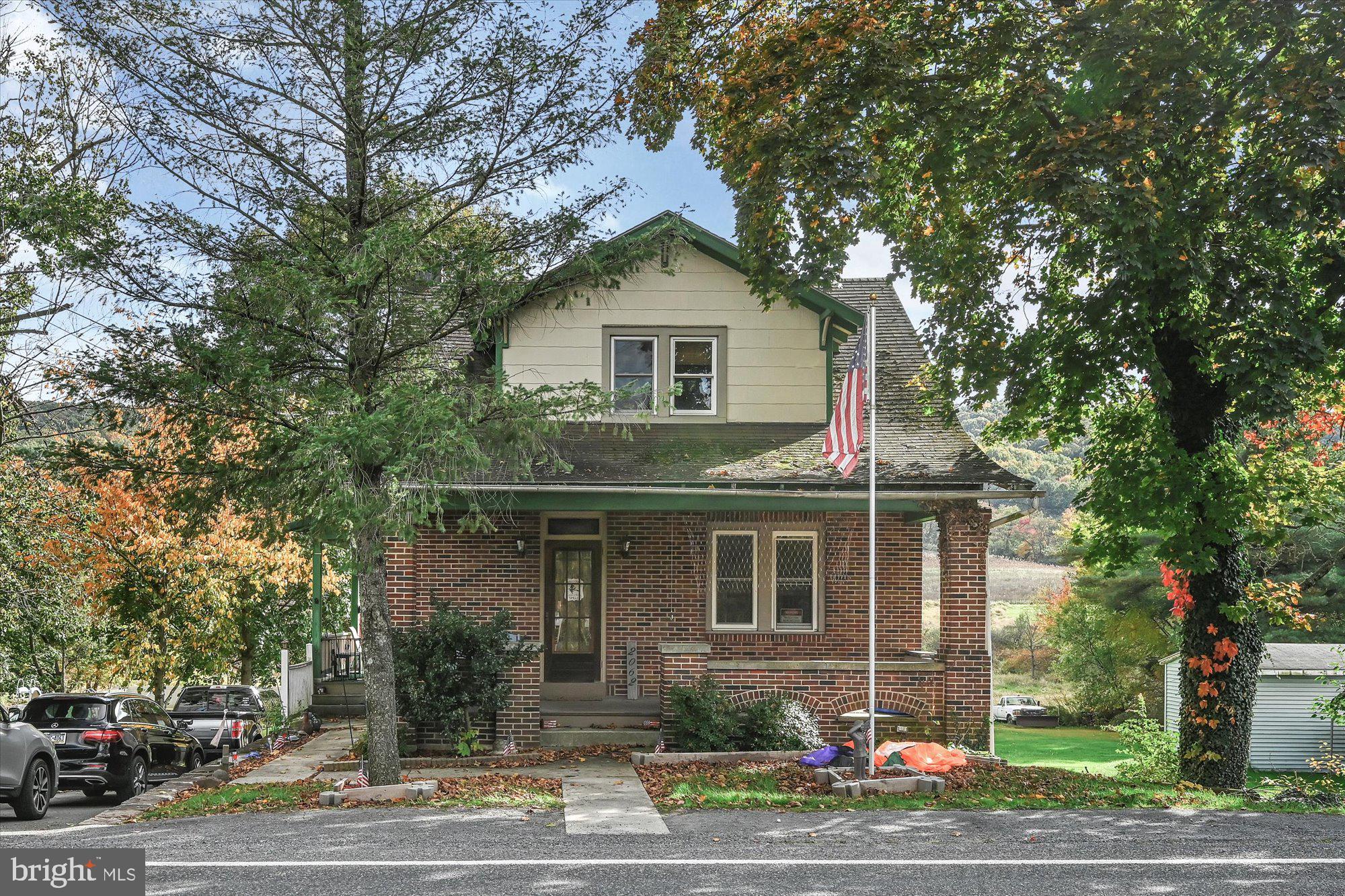 Charming  brick home! Blue Mountain School district.  Covered front porch to the main entrance welcomes you.  The living room area is accented by the character of the original wood work through-out. Original hardwood floors, high ceilings and open stairway . French doors welcome you into the dining room area, large windows, ceiling fans and access to the kitchen. Eat-in kitchen with access to the side covered porch and deck. Second level offers 2 private bedrooms with closet space, hardwood floors and a full bathroom. Full basement with two separate rooms for storage, open main area laundry room and utility space. Walk-Out basement to the attached storage shed, back patio and rear yard.  Scenic and unobstructed mountain views from the back deck and rear yard. Private driveway for 3 vehicles. Close distance to Bubeck Park, Schuylkill River, trails, Schuylkill Haven town amenities and more!