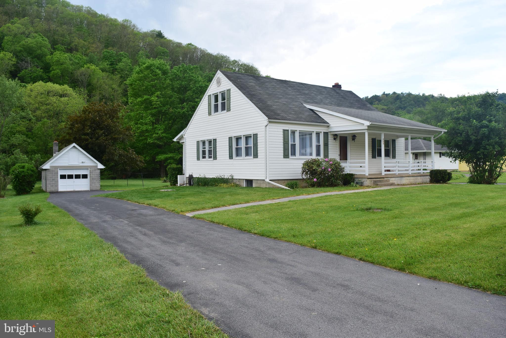 Charming BEASD Cape Cod tucked into a tranquil .7 acre setting with plenty of space, character, and functionality. This 4-bedroom, 1-bath home offers a flexible layout with a convenient main-floor bedroom and full bath and additional main level bedroom. Second floor includes two additional bedrooms and extra living space to fit your needs. The spacious eat-in kitchen provides room to gather, while a mix of hardwood flooring, durable LVP and carpet adds warmth and practicality throughout the home. Forced-air heat and central air conditioning add comfort and convenience.  
The walk-up lower level features laundry and an unfinished workshop area with endless potential for hobbies, or storage. Enjoy quiet mornings and relaxing evenings from the home’s two porches overlooking the peaceful surroundings. 

Outside, you’ll find a convenient, asphalt circular driveway, a detached 15x31 one-car garage with extra storage space above, along with an additional 10x12 shed for tools and equipment. Fish off your own land at the back of the lot where Wallace Run trout stream runs through.  

A wonderful opportunity to enjoy comfortable living with charm, storage, and workspace both inside and out.