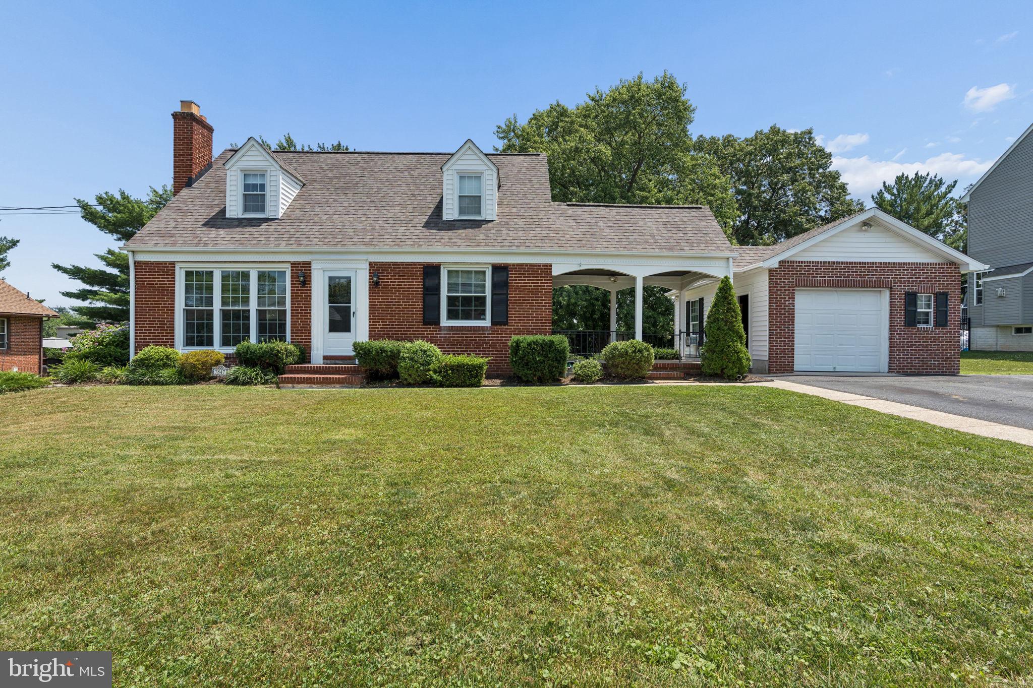 A beautifully maintained and updated 3BR/2BA expanded brick Cape Cod home is situated on a lush lot in the desirable neighborhood of Overlea. Pull into the double-wide driveway, conveniently located just outside the garage and the attached breezeway. Make your way past the meticulously pruned landscaping to the front door of your new home, which welcomes you with abundant natural light, gleaming hardwood flooring, an open floor plan, and a neutral color palette. The main floor features a spacious living room that flows seamlessly into the dining area and a gorgeous, kitchen. The kitchen is equipped with abundant cabinetry, granite countertops with a stone tile backsplash, sleek black appliances, a stainless steel sink, and a peninsula overlooking the dining room—perfect for hosting family and friends. The main level also includes a primary bedroom with a generous closet and a full bathroom featuring a walk-in shower. Off the dining room, you will find a bright sunroom with three walls of windows, while a barn door off the living room reveals a mudroom with custom cubbies and access to the breezeway. The second floor offers two spacious secondary bedrooms and a full bathroom. The finished lower level boasts a large recreation room with sliding doors leading to a spectacular yard, along with laundry facilities, storage, and utility space. Stepping outside from the kitchen, you’ll discover a beautifully landscaped yard offering plenty of green space, mature trees, and shrubs. The attached garage, accessible via the breezeway, provides parking for one car plus extra storage for outdoor gear. This move-in-ready home is ideally located near shopping, restaurants, and major commuter routes.