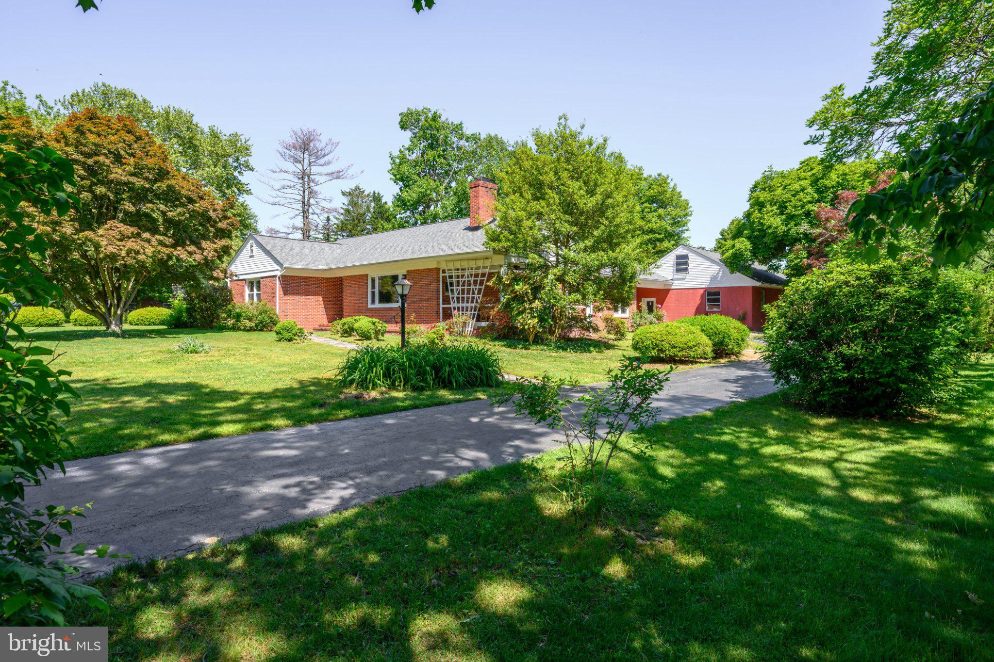 Charming Brick Rancher Near the Chester River
This custom-built brick rancher sits in a nice Chestertown neighborhood with excellent curb appeal, a classic hipped roof, and a convenient circular driveway. The drive runs under a gable-roofed breezeway that connects to an oversized 26x40 two-car garage, which will soon have brand-new garage doors. 

Coming into the Home...
Living Room: Walk along the cobblestone slate path and pass through the new, classic front door into a spacious living room featuring hardwood floors that run throughout the entire house.

Dining & Kitchen: A curved archway leads from the living room directly into the dining room. The dining room has an entryway to the kitchen, which could easily be opened up for an even more open feel.

Porch: The dining room leads right out to a comfortable porch—the perfect spot to relax and enjoy this nice, quiet neighborhood.

Mudroom & Back Entry: An oversized back entry from the breezeway leads into a large mudroom and utility space. Featuring multiple closets and laundry hookups, this functional area offers plenty of space to be creative and fit your family's needs.

Bedrooms: 
The main floor includes three bedrooms with hardwood floors and two full bathrooms

Basement: The full basement features an open space with brand-new windows that allow plenty of natural light inside. It is equipped with a new sump pump, offering a perfect blank canvas for storage, a gym, or a rec room.

Utilities, Key Updates & Location
The house sits on a generous lot with mature landscaping and is connected to well water and public septic. Recent mechanical and structural updates include: Brand-new roof, oil furnace paired with a new HVAC system for efficient heating and cooling. Fresh paint inside and out. You can enjoy beautiful views of the Chester River coming and going from your new home, as well as scenic river views while taking your neighborhood walks. Enjoy the convenience of being just minutes from downtown shopping and dining. Bring your design ideas to update the interior and make it your own!