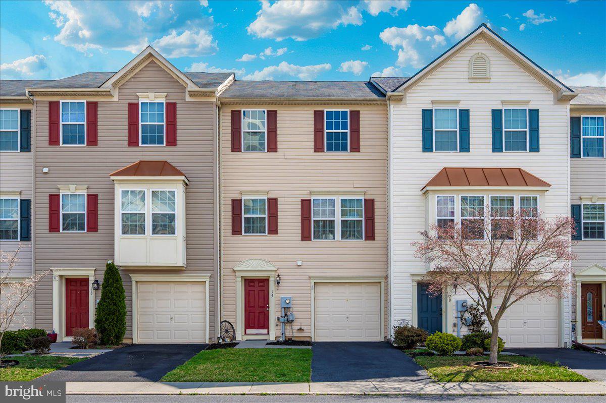 Welcome to 74 Tidewater Terrace, a beautiful townhome in the Brookfield community. The tree-lined entry into the community welcomes you home! Brookfield is well known for its private amenities,  including a boat ramp, a pavilion area, Potomac River access, a soccer field, hiking trails, and beautiful open spaces! The home features three bedrooms, two bathrooms, and a half bath. On the walk-in level, you will find an optional den, an outside exit to the backyard, a laundry room, and a half bath.  Enjoy spacious living with a massive updated deck, a fenced-in yard, and outside entry on the first and second levels. High ceilings, a kitchen island, tiled backsplash, and extended 42-inch kitchen cabinets are welcomed additions to this lovely home. The spacious primary bedroom upstairs includes a walk-in closet and a full-sized bathroom. The one-car garage and driveway offer ample space for your vehicle and extra storage. The washer and dryer are included in the sale of the home. Conveniently located near major thoroughfares, this home ensures easy access for commuters. Shopping, entertainment, and dining options are just minutes away. The property has been well-maintained and cared for. The home is a short drive from the Maryland line, commuter lot, the C&O Canal, and numerous recreational activities. You won't be disappointed!