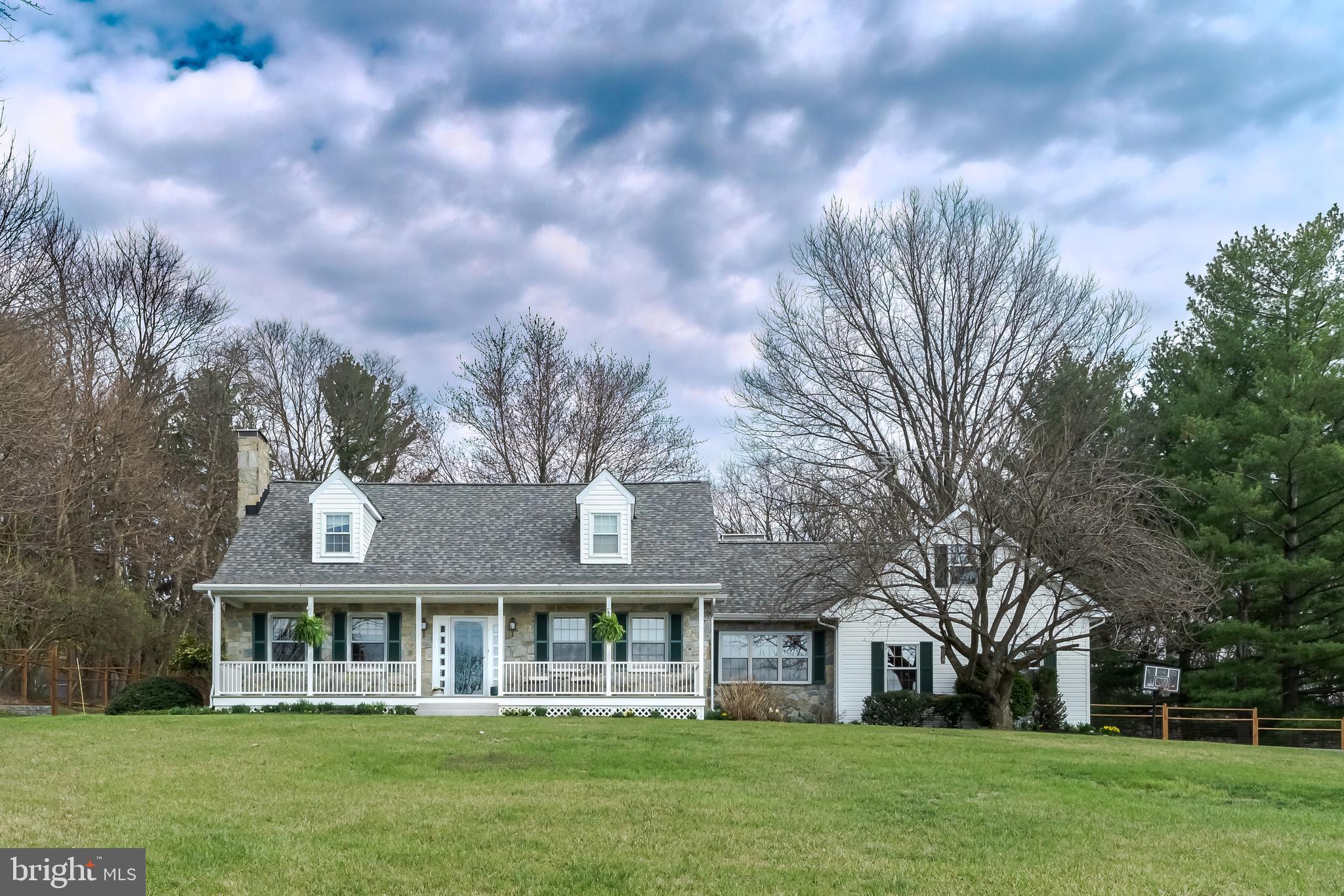 OFFER DEADLINE IS 04/07 AT 9:00PM. PUT IN YOUR BEST OFFER. Your dream home is here! This stunning custom stone Cape Cod in Braddock Heights sits on over an acre of land with breathtaking sunset views of the valley below. Step inside to warm character featuring original slate floors, rich wood paneling, exposed beams, and gleaming hardwood. The formal living and dining rooms offer crown molding, chair rail, and a bay window overlooking the backyard, plus a cozy pellet stove. The updated country kitchen provides abundant cabinetry with built-in pantry, Corian countertops, fresh backsplash, and a peninsula with seating. Relax in the inviting family room with bamboo flooring and direct access to the attached two-car garage. Upstairs, the primary suite includes an en-suite bath and two oversized closets.  Enjoy the oversized front porch and private backyard in the highly sought-after Middletown school district. Come to the open house today and make this exceptional property yours before it’s gone!