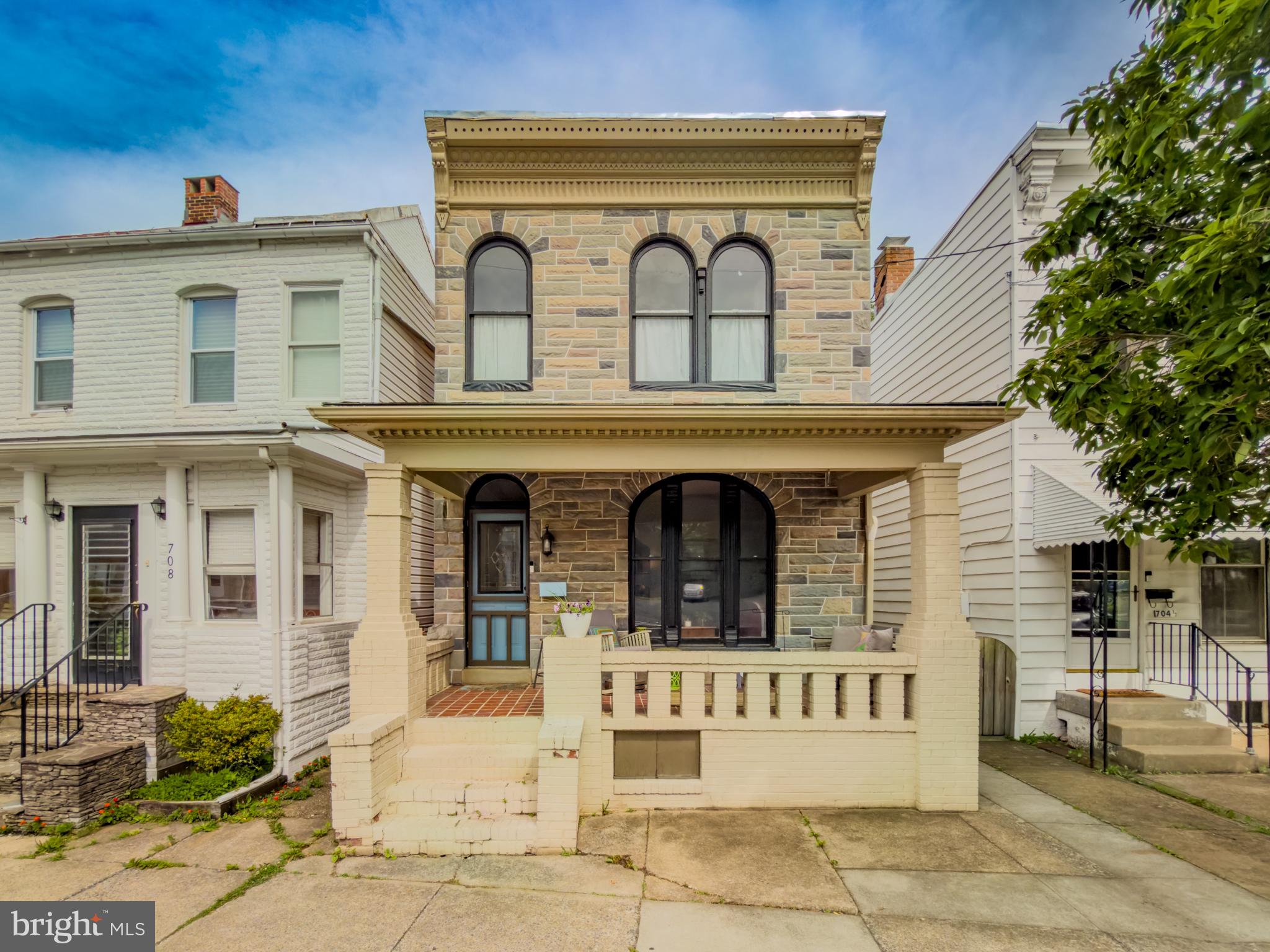 Rare opportunity to own a distinctive detached home with Victorian charm in Downtown Frederick, where historic charm, architectural character, and everyday livability come together in a way that is getting harder to find. 706 N Market St makes a memorable first impression with its striking stone façade, covered front porch, tall arched windows, and classic period details. Inside, the home continues to deliver with warm wood floors, a beautiful original staircase, and inviting living spaces with real character.

At the same time, this home offers the features today’s buyers are looking for, including an updated kitchen, a beautifully renovated primary bath, flexible living spaces, and outdoor areas that add real function to daily life. Enjoy a rear patio, private upper walk-out balcony, and deep fenced yard with room to garden, entertain, relax, or play.

Set in Downtown Frederick, this location puts you close to the restaurants, shops, parks, events, and energy that make life in The City of Frederick so desirable. Whether you are drawn to the historic streetscape, the vibrant small-business community, or the convenience of living in heart of downtown, this home offers a chance to enjoy one of Frederick’s most loved settings from a property that feels genuinely special.