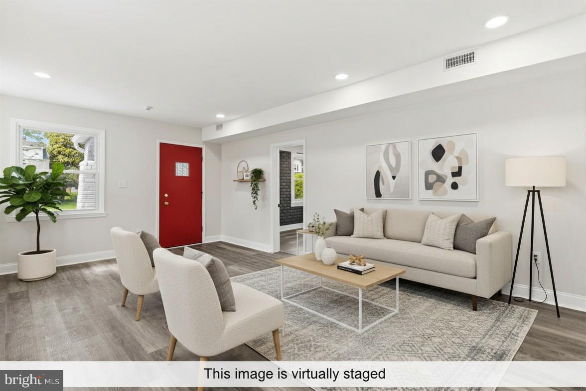 Nestled in the heart of Parkville, this fully updated and well-maintained home offers a versatile layout featuring 5 bedrooms, 3 full bathrooms, and 2 flex rooms with potential for up to 7 bedrooms. The main level features an open-concept living and dining area, recessed lighting throughout, and a bright modern kitchen with waterfall island, stainless steel appliances, and plenty of cabinetry and counter space, plus a laundry room with access to the backyard deck. The upper level offers a spacious private bedroom and full bathroom. The fully finished lower level offers additional living space perfect for extended living, office, gym, or entertainment area. Enjoy a rear carport, rare driveway, off-street parking, and a spacious backyard ideal for entertaining. Conveniently located near shopping, dining, parks, and major commuter routes. Don’t miss this incredible opportunity — schedule your private tour today!