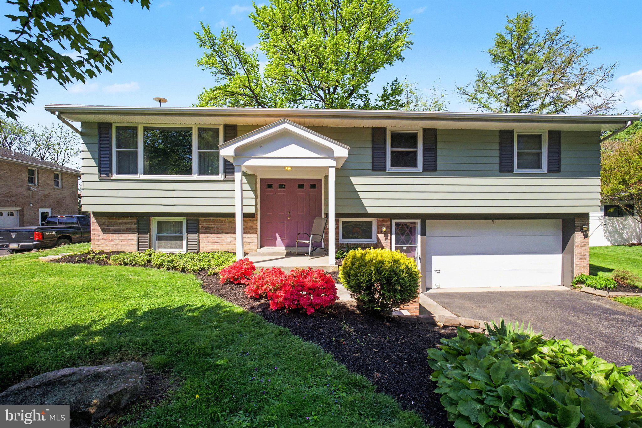 SHOWINGS Start Saturday!!  Welcome to 1811 Amity Drive, a warm and inviting 4-bedroom, 2.5-bath home nestled in a beautiful neighborhood within the highly regarded Manheim Township School District. This charming bi-level offers  curb appeal with its attractive brick and vinyl exterior, mature landscaping, and easy-care design. Step inside to the main level, where hardwood floors and expansive windows fill the open living and dining areas with natural light, creating a bright and welcoming space for everyday living and memorable gatherings. Just off the dining area, the kitchen offers plenty of room for cooking and casual meals, with a lovely view of the backyard. Down the hall, you’ll find two generous closets, an updated full bath, and three comfortable bedrooms, including a primary suite with its own private bath—a peaceful retreat at the end of the day. The lower level adds even more living space with a cozy family room featuring a fireplace and built-in bookshelves, perfect for relaxing, reading, or gathering with friends. Large windows and a walk-out door to the patio make it easy to enjoy the backyard, watch the birds, and take in the quiet surroundings. This level also includes an additional bedroom and a modern half bath, offering flexibility for guests, a home office, or hobby space. The spacious two-car garage provides convenient access to the laundry room, along with extra room for a workbench, tools, and storage. Lovingly cared for by the same family for more than 40 years, this home offers a rare combination of comfort, character, and location—close to shopping, groceries, restaurants, and major highways, yet tucked away in a peaceful community ideal for walking, running, or biking. Don’t miss the opportunity to make this special home your own and plant roots in a place that truly feels like home.