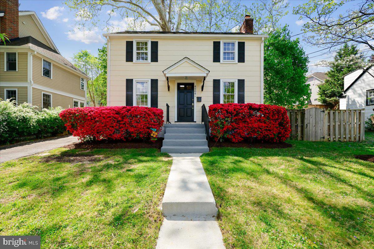 Nestled on a tranquil street in sought-after Glenbrook Village, this charming Colonial seamlessly blends timeless character with modern updates. Freshly painted throughout, the home showcases newly refinished hardwood floors on the main and upper levels, creating a warm and polished feel from the moment you enter.

The inviting living room is centered around a classic brick fireplace, offering a cozy gathering space filled with natural charm. The updated kitchen features stainless steel appliances, refreshed countertops, and a convenient eat-in counter that opens to the dining room for effortless entertaining and everyday living.
Upstairs, two sun-filled bedrooms provide comfortable accommodations with classic appeal. The versatile lower level has been updated with brand-new luxury vinyl plank flooring and a full bathroom, making it ideal as a recreation room, guest suite, home office, or potential third bedroom.

An exceptional alternative to condo living, this home offers the comfort, privacy, and charm of a single-family residence while remaining manageable and efficient. Perfect for a small family or those seeking a simplified lifestyle, it provides everything needed for comfortable everyday living in the highly desirable East Bethesda community. Enjoy being part of a vibrant and social neighborhood known for its walkability, community feel, and unbeatable convenience.

Perfectly positioned just blocks from Walter Reed, NIH, and Metro access, this home also offers easy access to the trails of Rock Creek Park and the exceptional dining, shopping, and entertainment of downtown Bethesda. A wonderful opportunity in an unbeatable location.