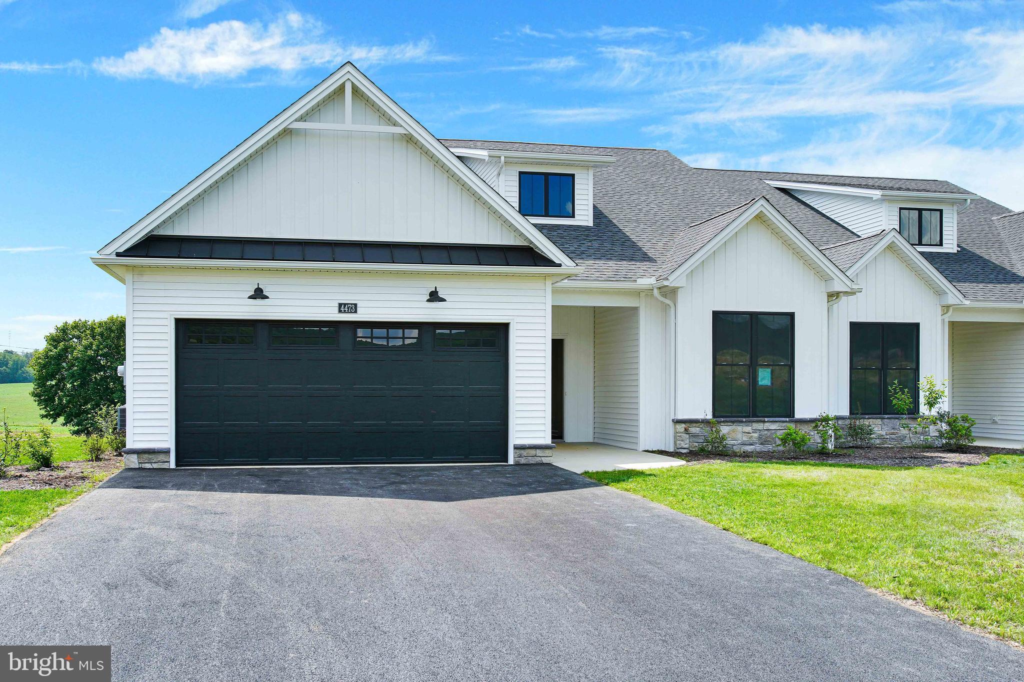 Welcome to the Range Neighborhood in Penn National Community! Discover a friendly, maintenance-free neighborhood of charming modern farmhouse style homes that are right-sized for your lifestyle. This home features two bedrooms, two baths, and a great room that is open to the kitchen area. Great room has gas fireplace. Screened rear porch. Primary suite features a custom tile shower. Walkup storage room on upper level. HOA fee is $145 per month and covers lawn care, snow removal, and trash. Penn National Community offers 36 holes of 4-star golf, outdoor pool, tennis/pickleball, yoga, community garden, 40 + social clubs, restaurant/bar, and so much more!!