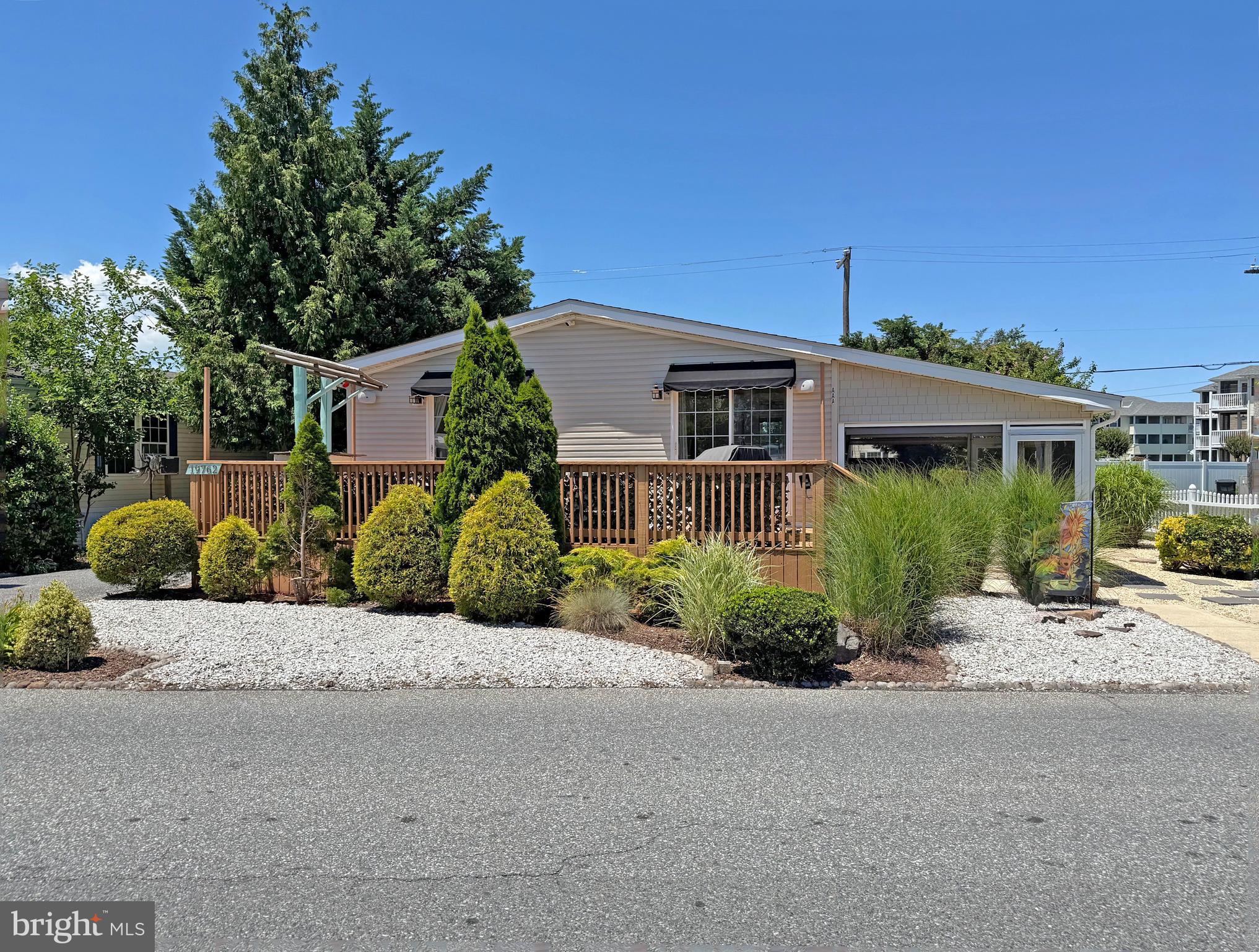 This showcase home has extensive hardscaping and sits at the entrance of the community. The beautiful Rehoboth boardwalk and beaches are approximately 2 miles the house. And the Cape Henlopen State Park is about 6.5 miles away. The DART bus has a stop just outside of the community at the IHOP restaurant for those days when you don’t want to hunt for in-town parking. Plus, there is a large community pool just two blocks away for fun summer days. This home features a bright coastal interior with an open concept floor plan. Vaulted ceilings, skylights, and newer luxury vinyl plank flooring all add to the contemporary look. The living room, dining area, and kitchen all adjoin - plus there’s a family room off of the kitchen. The recently remodeled kitchen has dazzling quartz countertops, a tile backsplash, and stainless steel appliances. The appliances include a fridge with ice maker, gas range, built-in microwave, a dishwasher, and a disposal. The laundry room is next to the kitchen, and it has a side-by-side, front-load washer/dryer set. Popular split bedroom plan! The main bedroom is en Suite. That bath has two sink vanities and a tiled, walk-in shower. The other two bedroom share the second full bath, which has a tub/shower combo. Both of those bedrooms feature a sliding glass door to the deck. There’s also a side screened porch. In addition to the deck and screened porch, you’ll also find a side patio area. There’s an outdoor shower and shed that could be converted into the world’s best Man-Cave/She-shed with a little plumbing and electrical work. In addition to the kitchen, lots of “newer” components, too: roof, HVAC, water heater. The property is subject to an annually-renewable leasehold interest: Lot Rent is $766.62/mt. (lease renews annually on March 1, with any future lot rent increases capped as per 25 Del. C. Sec. 7050-7054). Water is included in the lot rent with Buyer paying for all other utilities. A Park application is required, and a Buyer will be accepted as a Resident based on the following criteria: 1.)income verification, 2.)credit bureau score, including evaluation of debt-to-income ratio, and 3.)criminal background check. Note: Rentals are NOT permitted in this community - but friends & family may always visit. Two pets are allowed. Financing may be available to qualified borrowers only from Lenders that specialize in installment/chattel loans for manufactured homes on leased land. Closing costs include a 3.75% real estate transfer tax (DMV Doc Fee), a Settlement Agent fee, and misc. pro rata amount.