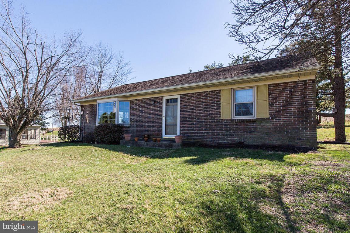 Spacious one story home with beautiful country views; Cozy kitchen w/skylight; Two beautiful bay windows in Kitchen & Dining room allow lots of natural light; Harvey triple pane insulated replacement windows (2006); Laundry/mud room addition w/tons of storage & space; All one floor living; Walk up attic for storage; Lower level ready to be finished; Central Air; Washer, dryer, refrigerator included.