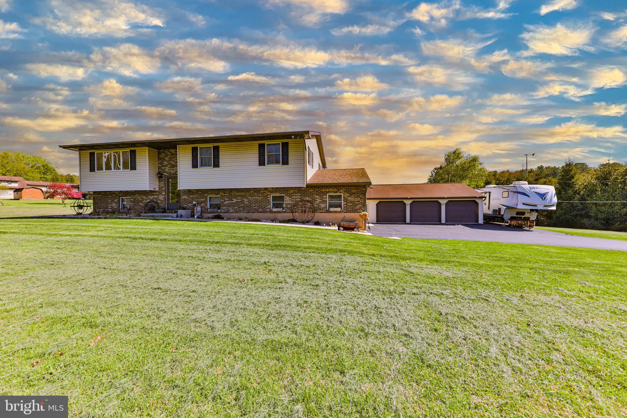 ONCE IN A WHILE YOU COME ACROSS A HOME THAT HAS SOMETHING FOR EVERYONE IN THE FAMILY . . . this spacious 4-BR, 2-BA Bi-level nestled on 1.44 acres in Towamensing Township, Lehighton School District, PROMISES that and more! Recently remodeled . . . with over 75K in renovations and upgrades during the seller ownership; "Bamboo" wood floors in living, kitchen, dining and hallway, wall/wall carpeting in bedrooms, and family room, replacement of lighting fixtures, ceiling fans, fixtures, wood deck replaced with Trex, replaced micro inverters in solar panels, and the rooms in the home repainted, to name a few! The spacious rooms and open floor plan allow you to move freely throughout the home. The living room, currently used as a dining room, features a large bay window with sliding doors in the kitchen allowing for natural lighting! Stroll out to the spacious re-designed eat-in kitchen with it's “NEW LOOK”, with granite counters, wood cabinets, stainless appliances, and the addition of a 5' center island allowing for creative cooking that seats 4! The main bathroom was remodeled with a new vanity, shower, fixtures, flooring, plus, the doorway opened to allow for an easier flow from the hallway through the bathroom into the primary bedroom. There's also same 2 size bedrooms on the main floor. The finished lower level features a spacious family room, with a propane stove, full bath with laundry and a spare room that can be used as a home office or 4th bedroom. Walk out from the kitchen onto the "NEW" rear wood deck with stairs and railings, perfect for relaxing and enjoying the evening sunsets, that leads out to the above ground pool, patio and Firepit, all in the rear yard! Extend entertaining your friends and family in the fully appointed gathering/recreation room, complete with hot tub, attached to a (24' x 32') 3-car insulated and heated garage. A built-in 2-car garage, with work space, solar panels to keep your electric affordable, detached shed, rolling greens, shade trees and beautiful landscaped gardens completes this great package. Conveniently close to Blue Mountain Resort, Beltzville Lake, Penns Peak, and local Pocono tourist attractions. Plus, minutes to PA Turnpike, Rts. 209, 309, 33 and 80 makes it a breeze with easy access to LV Mall, local shopping, ABE, Philadelphia and Newark airports or commuting to New York or New Jersey!