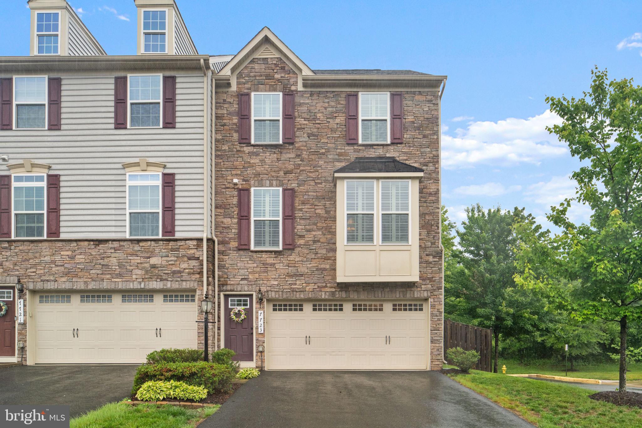Nestled in a serene enclave, this exquisite end-of-row townhouse  backed by huge greenspace, embodies the perfect blend of modern and convenience and timeless luxury.  Built in 2016, this Colonial-style residence showcases a stunning façade of aluminum siding and stone, inviting you into a world of refined comfort.   Step inside to discover a spacious 2,373 square feet of thoughtfully designed living space, where every detail has been curated to enhance your lifestyle.   The open-concept layout seamlessly connects the living, dining, and kitchen areas, creating an inviting atmosphere perfect for both entertaining and everyday living.  Large windows bathe the interiors in natural light, highlighting the elegant finishes and creating a warm, welcoming ambiance.  Elegant plantation shutters grace every window in this beautifully appointed home.  The heart of the home is undoubtedly the gourmet kitchen, equipped with high-end appliances and ample counter space, making it a culinary haven for experienced chefs and casual cooks alike.  Whether hosting intimate gatherings or grand celebrations, this space is designed to impress.  Retreat to the luxurious bedrooms, each offering a tranquil escape from the hustle and bustle of daily life.  The bathrooms are a sanctuary of relaxation, featuring modern fixtures and finishes that elevate your self-care routine to a spa-like experience. Outside, the property boasts a charming patio area, perfect for morning coffee or evening gatherings under the stars. The meticulously landscaped surroundings provide a sense of privacy and tranquility, allowing you to unwind in your own personal oasis.  Enjoy the convenience of nearby amenities, including upscale shopping, fine dining, and recreational opportunities, all within easy reach. The community exudes a sense of  a peaceful retreat while remaining connected to the vibrancy of urban living. With its impeccable design, luxurious features, and prime location, this townhouse is a rare gem that promises to elevate your everyday living experience. Embrace the opportunity to call this stunning property your home, where comfort meets sophistication in perfect harmony.