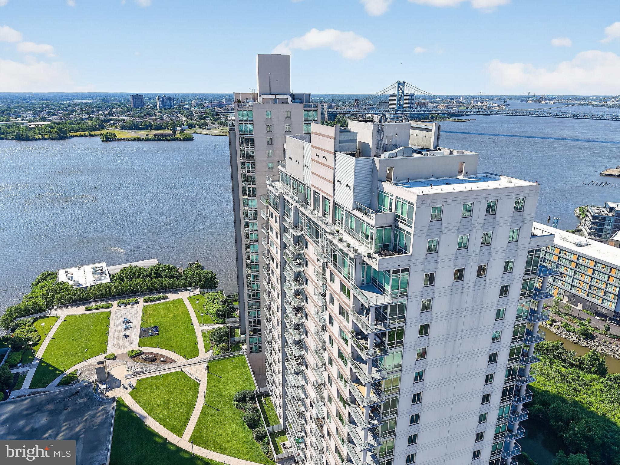 There are penthouses... and then there is The Penthouse.

An exceedingly rare and truly once-in-a-lifetime opportunity awaits in Waterfront Square, Philadelphia's premier gated waterfront community. Encompassing more than 7,500 square feet across two spectacular levels, this is the largest bi-level penthouse residence in the community - an offering of unparalleled scale, sophistication, and commanding views.

Designed for those who refuse to compromise, this exceptional residence features five spacious bedrooms, four full bathrooms, and one half bath, thoughtfully arranged to provide the comfort and privacy of a single-family home with the convenience and security of luxury condominium living.

Walls of floor-to-ceiling glass flood the home with natural light while framing breathtaking panoramic views of the Center City skyline, the Delaware River, and the iconic Ben Franklin Bridge. Nearly every room opens to the outdoors, seamlessly blending interior and exterior living.

Adding to its unmatched appeal is more than 2,000 square feet of private terrace space - an extraordinary outdoor retreat perfect for elegant entertaining, intimate gatherings, or simply enjoying sunrise over the river and the dazzling city lights each evening.

Recently refreshed throughout, the residence showcases fresh designer paint, new luxury vinyl plank flooring, and a beautifully renovated main gourmet kitchen appointed with contemporary finishes and abundant workspace. A second full kitchen on the upper level creates exceptional flexibility, making the upper floor ideal as a private guest residence, multi-generational living space, executive retreat, or the ultimate entertaining level.

Whether hosting grand-scale events or enjoying the serenity of luxury waterfront living, this remarkable penthouse delivers an experience unlike anything else in Philadelphia.

Residents of Waterfront Square enjoy an exceptional collection of resort-style amenities including 24-hour gated security, concierge service, valet parking, state-of-the-art fitness facilities, indoor lap pool, spa, riverfront walking paths, beautifully landscaped grounds, and convenient shuttle service to Center City. Just minutes from Philadelphia's finest restaurants, cultural institutions, sporting venues, and major highways, this is luxury living without equal.

A residence of this caliber is rarely offered and impossible to replicate. This is more than a home-it is one of Philadelphia's most extraordinary addresses.
