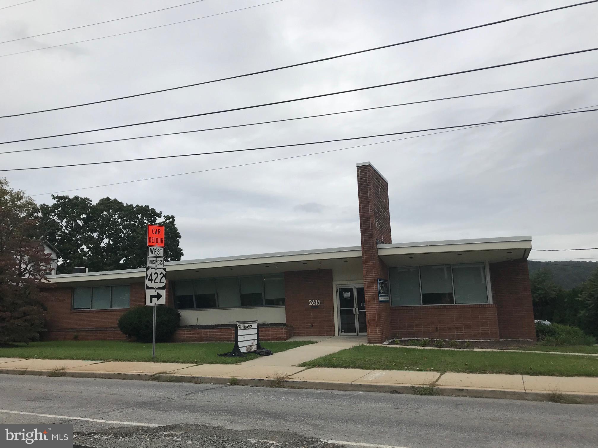 Brick/ Masonry building along Perkiomen Ave zoned Local Commercial (C-1) invites Business, Professional, Medical/Dental/Vision, Health Care/ Fitness and many other uses:  First Floor (3,780 SF) includes entry foyer, reception/clerical area, waiting room, 4 office/exam rooms, large (30'x60') open area, office/supply room and 3 restrooms;  Lower level (961 SF) is accessible, on grade from rear, with lounge area, meeting room, full bathroom and kitchen.  Property has natural gas, public sewer & water, newer rubber roof (2014) and 25+ car parking.