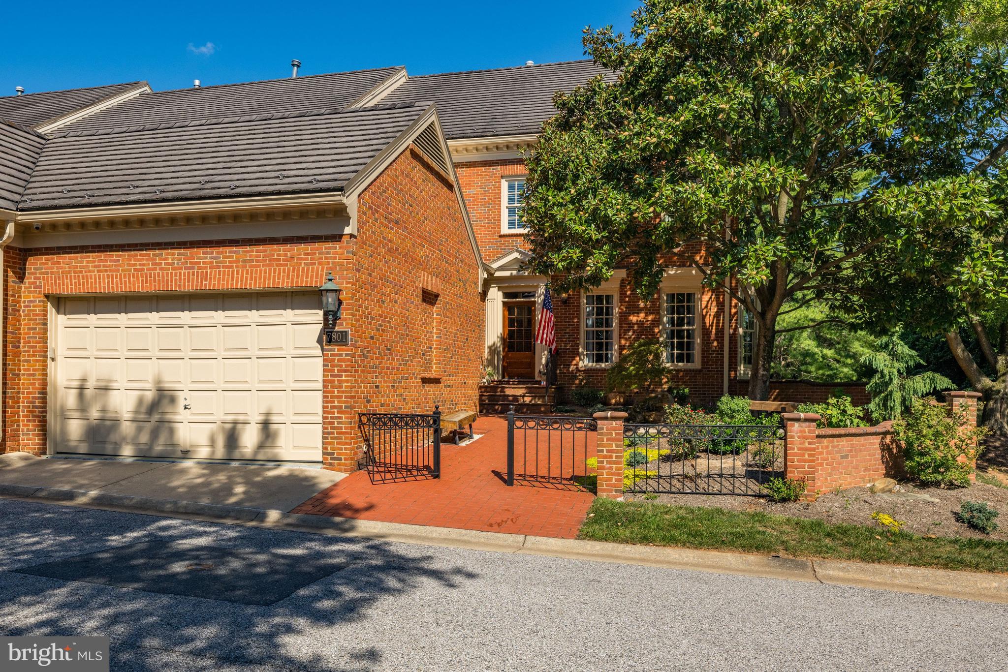 Introducing 7801 Hidden Meadow Terrace, a truly fabulous townhome in Potomac, Maryland that has been renovated from top to bottom with no detail overlooked. This stunning three-sided brick end-unit residence offers over 4,500 square feet across three finished levels, featuring five spacious bedrooms and three-and-a-half bathrooms. Step through the front gate and into a charming front patio retreat, where a tranquil waterfall feature creates an inviting first impression. Continue inside the front door, where gleaming refinished hardwood flooring immediately captures the eye. The kitchen has been transformed and reconfigured into a true gourmet showpiece. A suede granite waterfall countertop serves as showstopper, while sleek Quartz countertops and an elegant marble subway tile backsplash elevate the design. Custom inset cabinetry with polished nickel hardware provides abundant storage. A deep single-basin undermount ROHL sink pairs seamlessly with premium stainless steel appliances, including a six-burner Wolf gas cooktop and Sub-Zero refrigerator. An eat-in area creates the perfect everyday gathering space, while the attached two-car garage, complete with additional overhead storage ideal for larger items and seasonal belongings, makes grocery trips incredibly convenient. Continue through the main level to the reimagined club room, a lounge and entertaining space curated with custom built-in cabinetry and centered around a sophisticated built-in bar. Complete with a built-in Zephyr beverage refrigerator, the bar is flanked by Visual Comfort sconces art and integrated lighting. The spacious living room is centered around a gas fireplace and surrounded by walls of windows, creating a bright living space. The formal dining area is framed by two architectural columns, offering gracious space to accommodate larger parties with ease. Custom window treatments add a refined touch, while a striking chandelier anchors the room. The primary suite serves as a true retreat, thoughtfully renovated from top to bottom with luxurious finishes throughout. The sizable bedroom is anchored by a stunning light fixture, and offers a comfortable sitting area. Continue into the spa-inspired primary bath and dressing area, where a traditional and red-light Finnleo sauna awaits. Tucked behind a pocket door, the beautifully reimagined bathroom showcases custom inset cabinetry, marble flooring, Kohler undermount sinks, and an oversized walk-in shower complete with dual shower heads, handheld extensions, and an Elite steam shower system. Two additional bedrooms share a renovated Jack-and-Jill bathroom featuring dual vanities, and a walk-in shower adorned with designer tile. The upper-level laundry room has also been outfitted with custom cabinetry and a utility sink. The lower level of this home offers an impressive amount of flexible living space designed for every activity and lifestyle need. A recreation room, dedicated fitness area featuring a Tonal system, and generous storage room complete the interior, all with direct walk-out access to the backyard. Outside, every inch of the backyard has been improved. Enjoy a brand-new deck complete with a ceiling fan, an expansive refinished patio with extensive hardscaping, and a saltwater pool featuring a new liner and automatic cover. Designed with entertaining in mind, the home is also equipped with a built-in sound system and integrated speakers throughout the kitchen, club room, and outdoor deck, creating a seamless indoor-outdoor experience. If you are searching for a home that is completely turnkey and renovated to the highest standard, look no further. River Falls is a special community offering a neighborhood pool, clubhouse, tennis courts, playgrounds. With every detail already completed and so much to offer both inside and out, this extraordinary home presents a rare opportunity not to be missed.