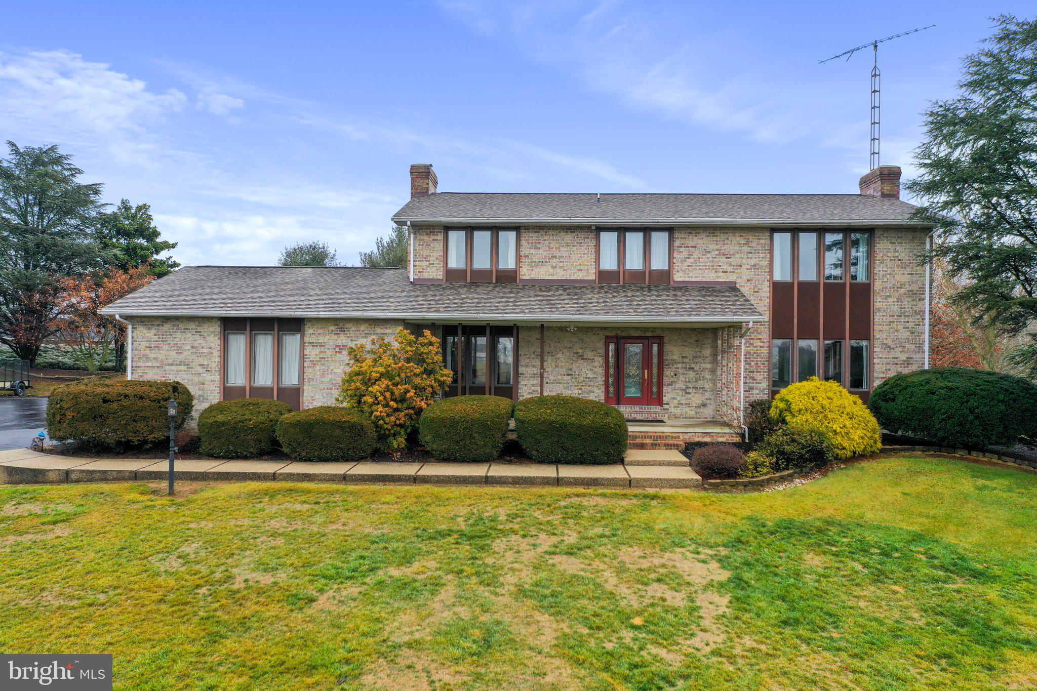 This exquisite, all-brick home wows with a private clay tennis court, new roof, completely revamped kitchen and primary bathroom! Revel in the remodeled kitchen featuring custom Hess cabinets, gleaming quartz counters, & top-of-the-line Electrolux appliances, including a 36" induction stove and a wine fridge. And a real sign of luxury, a pot filler right over the stove! Unwind in the sunken living room or on the concrete back patio where you can enjoy the view of your garden beds filled with perennial plants.

Freshly painted, this gem boasts new carpets and flooring throughout the home. Retreat to spacious bedrooms, each with new carpet & the primary featuring dual ceiling fans, fresh paint, Pottery Barn closet organizer system in primary, & a spa-like bathroom with heated towel rack, freestanding tub, Bluetooth shower, & double vanity with built-in electric. The 4th bedroom does not have a closet currently and is used as a home office. The back bedroom and primary suite both have access to the second floor rear deck.

The half finished basement offers endless possibilities. On the current unfinished/storage side the newer furnace, radon system, well water with UV light & softener, & central vacuum ensure peace of mind. Washer/dryer (new in 2020), Simplisafe alarm system & garage pegboard convey for ultimate convenience.

Sunrise greets you from the composite board back deck, while sunsets paint the front porch. This Waynesboro gem offers unparalleled amenities & unmatched charm. Don't miss your chance to call this piece of Wayne Heights home!