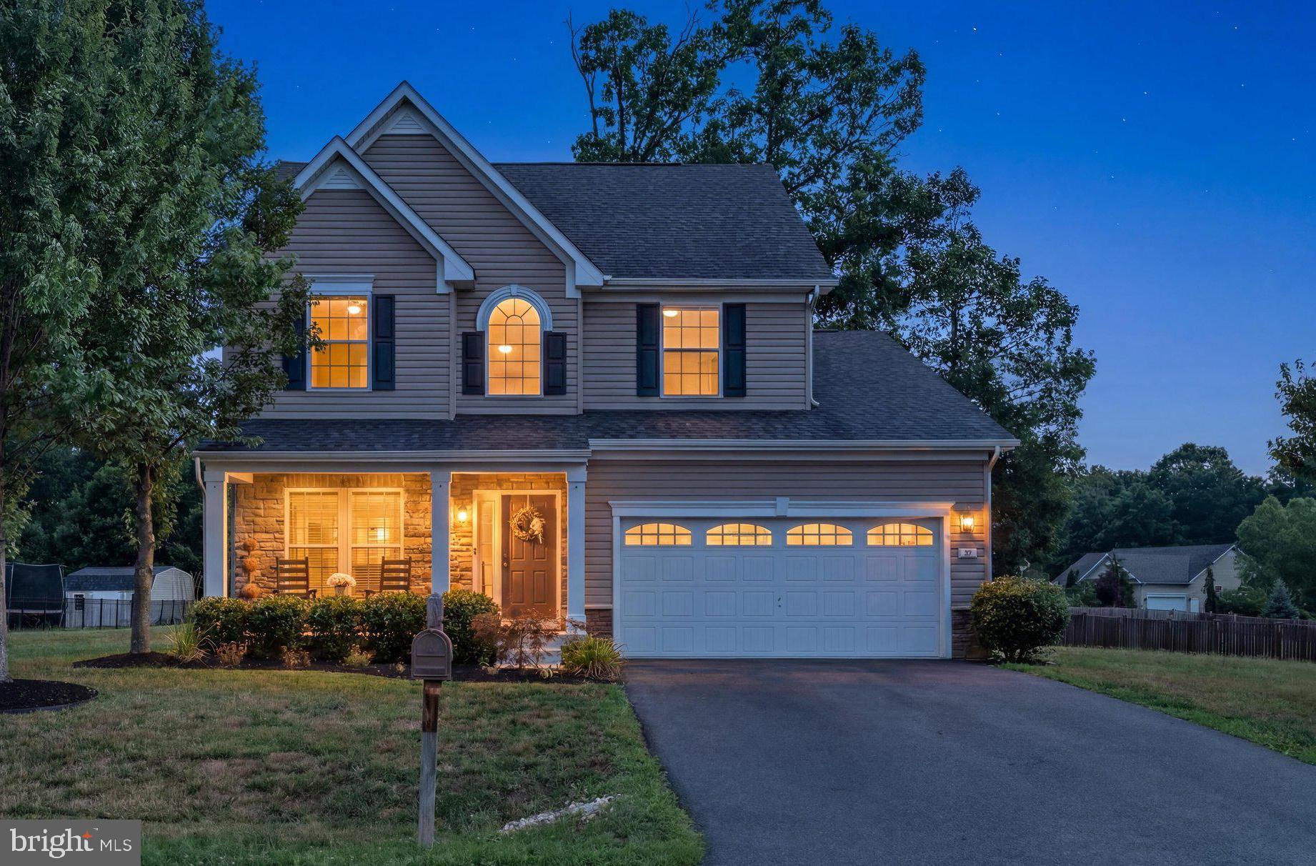 You’ll LOVE where you live in this exquisite, well-appointed beauty! Feels like a brand new model home from the moment you walk in the entry where you’re welcomed by an inviting living room adorned with crown molding and chair rail and 5” hand scraped hardwood flooring.  You will be in awe as you make your way to the open-flow kitchen, dining area and family room, all also with the same hardwood flooring. This kitchen of your dreams offers 42” maple cabinets with crown molding, granite countertops, custom, hand-cut backsplash tile, under counter lighting and island with breakfast bar. The morning room beams with natural light from the many windows that encase it and the spacious family room provides the heart of the entire open and functional space. Upstairs you’ll find a huge loft providing flex space ideal for a cozy retreat spot, office space, play area, and many other creative uses. The primary suite is a luxurious private retreat boasting a tray ceiling, walk-in closet and bath with double vanity, tile floor, and extra-wide tiled shower.  The other two bedrooms are also nice sized and the main bath offers a tiled floor and tiled shower surround. The full basement provides walk-up stairs to the rear yard, a bath rough-in, water softener and two sump pumps. The back yard offers plenty of space for rest, recreation and entertainment with a beautiful stamped concrete patio and picturesque trees for shade. And how gorgeous is this curb appeal??? With recessed lights on the covered porch, stacked stone and upgraded carriage garage door with windows. Make this breathtaking gem yours this summer!