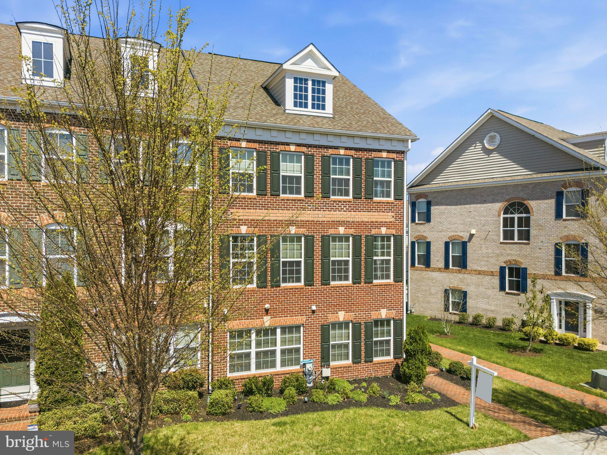PRICE IMPROVED! End Unit Across from Pool & Clubhouse + FHA Assumable 3.75% Mortgage for qualified Buyers!  Welcome to this beautifully upgraded end-unit brick townhome in the highly sought-after Beech Tree community. Offering over 3,000 square feet of finished living space, 3 bedrooms, 3.5 baths, and a two-car garage, this home combines space, style, and exceptional value. The main level features a spacious family room and full bath, creating the perfect space for guests, a home office, recreation room, or additional living area.
The heart of the home is the stunning open-concept second level, where the gourmet kitchen seamlessly connects to the dining and living areas. Designed for both everyday living and entertaining, the kitchen boasts granite countertops, a large center island with seating, stainless steel appliances, double wall ovens, a gas cooktop, abundant cabinetry, and stylish pendant lighting. The adjoining living room features a built-in electric fireplace, while the dining area provides direct access to the maintenance-free composite deck with pergola and privacy wall. Upstairs, the spacious primary suite offers a tray ceiling, walk-in closet, electric fireplace, and a spa-inspired bath with a soaking tub, separate glass-enclosed shower, and elegant tile finishes. Two additional bedrooms, a full hall bath, and convenient upper-level laundry complete the top floor. One of the home's most desirable features is its prime location directly across from the community pool and clubhouse. Residents enjoy access to Beech Tree's outstanding amenities, including the Lake Presidential Golf Club, swimming pool, fitness center, tennis courts, walking trails, restaurant, playgrounds, and clubhouse. Conveniently located near shopping, dining, and major commuter routes to Washington, D.C., Annapolis, and Northern Virginia. This is one of the largest and best-positioned townhomes in the community.  With an improved price, exceptional community amenities, and a rare assumable mortgage opportunity, this is one you won't want to miss. Schedule your private tour today. Photos have been virtually staged.
