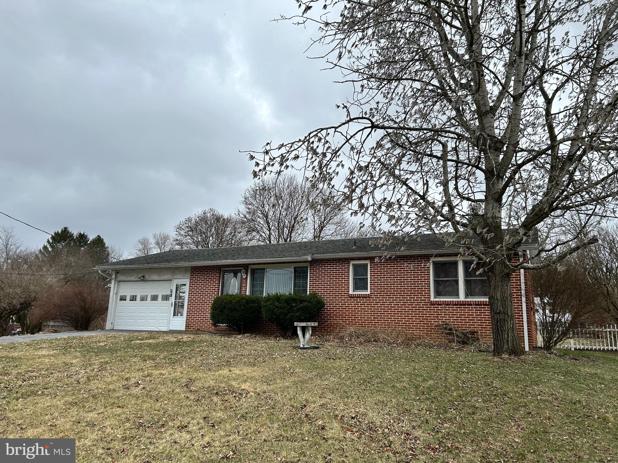 Beautiful ranch home with fenced yard area and 1 car garage. Lots of natural light in the garage makes it perfect for dual usage as a sunroom and/or picnic area.  Inside you will find 3 generous bedrooms, hardwood floors, and updated kitchen with lots of cabinetry.  Added bonus of  a large family room in lower level. with an office area too. All furnishings are negotiable making this property perfect for someone who needs a fresh start! Call for your tour today.