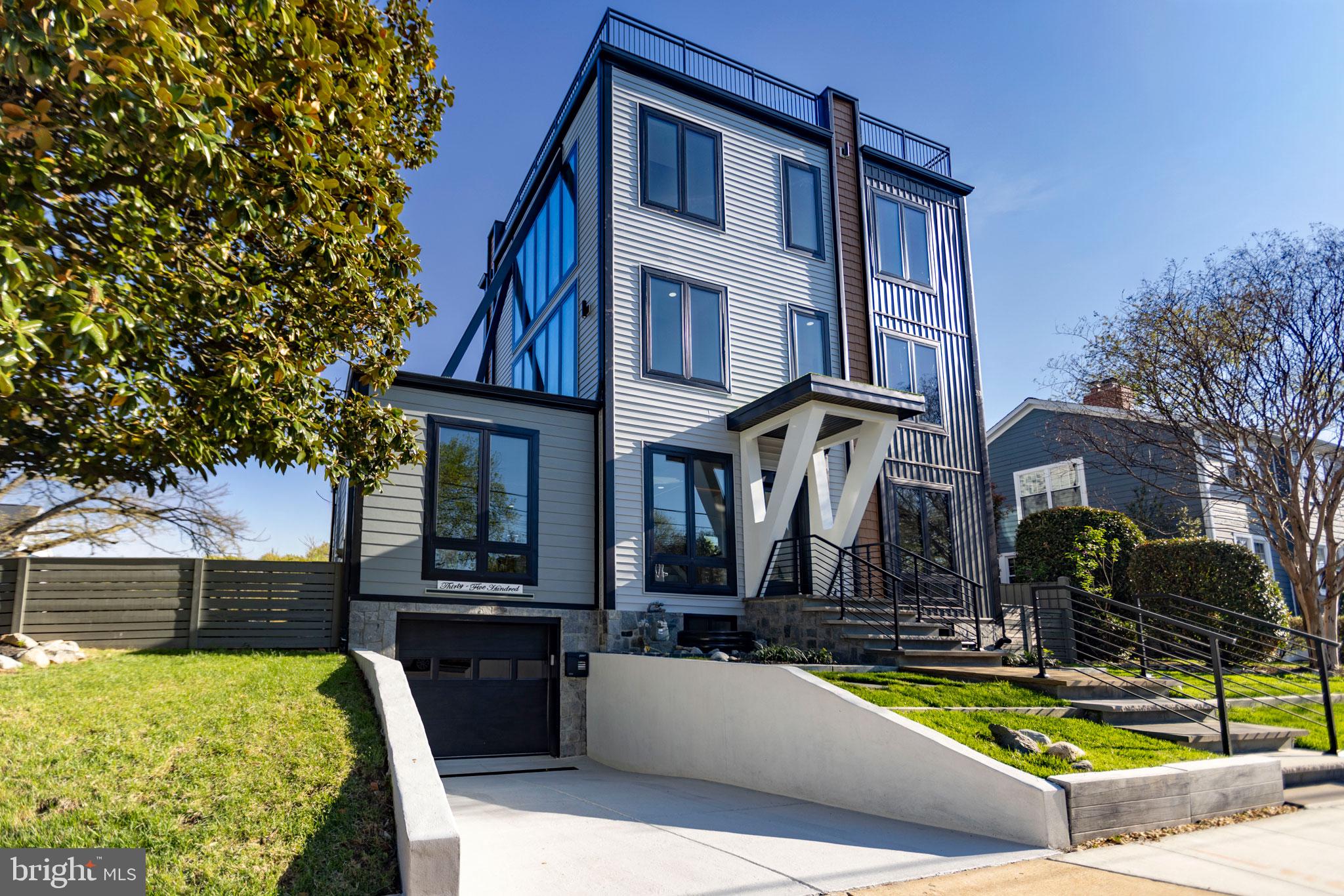Welcome to this exceptional four-level contemporary residence, offering six bedrooms, five-and-a-half baths, and approximately 5,200 square feet of thoughtfully designed living space.   A true highlight of the home is the spectacular rooftop deck, offering breathtaking views and an incredible space for entertaining or unwinding. This must-see outdoor retreat provides the perfect setting for sunset evenings, gatherings, or simply enjoying the surrounding scenery.  Perfectly blending modern sophistication with everyday functionality, this home delivers an elevated lifestyle in a prime, metro-accessible location with lots of space.  

The open-concept main level features soaring 10-foot ceilings, rich hardwood flooring, and elegant craftsman-inspired finishes, creating a bright and seamless flow ideal for both everyday living and entertaining.

At the heart of the home is a true chef’s kitchen, equipped with premium Viking appliances, including a 48-inch built-in refrigerator and dual dishwashers. Quartz countertops, custom cabinetry, and an expansive center island provide both style and functionality—perfect for hosting or preparing gourmet meals.

Each of the six spacious bedrooms offers comfort and privacy, complete with custom walk-in closets. The luxurious primary suite serves as a private retreat, featuring a spa-inspired bath with a freestanding soaking tub, a curbless multi-jet shower, and high-end designer finishes.

Smart home technology is integrated throughout, allowing for effortless control of lighting, climate, and security systems—all accessible via smartphone or voice command.

The fully finished lower level is designed for entertainment and relaxation, featuring a media room, fitness area with en-suite shower, wet bar, and fireplace.

Step outside to a beautifully landscaped outdoor setting featuring a fully fenced patio—perfect for private gatherings, outdoor dining, and relaxation. The professionally designed landscaping enhances both curb appeal and everyday enjoyment, creating a serene and inviting environment.

Additional highlights include energy-efficient systems, dual-zone HVAC, enhanced insulation, and Andersen Lifestyle windows that fill the home with natural light.

Ideally located just two blocks from the Virginia Square Metro, and just moments from top-rated restaurants, shopping, and vibrant urban amenities in Ballston, Clarendon, and beyond, with easy access to Amazon HQ2, the Pentagon, and Washington, D.C. while being only minutes to DCA (Reagan Airport)—this home offers the ultimate combination of luxury, convenience, and lifestyle.