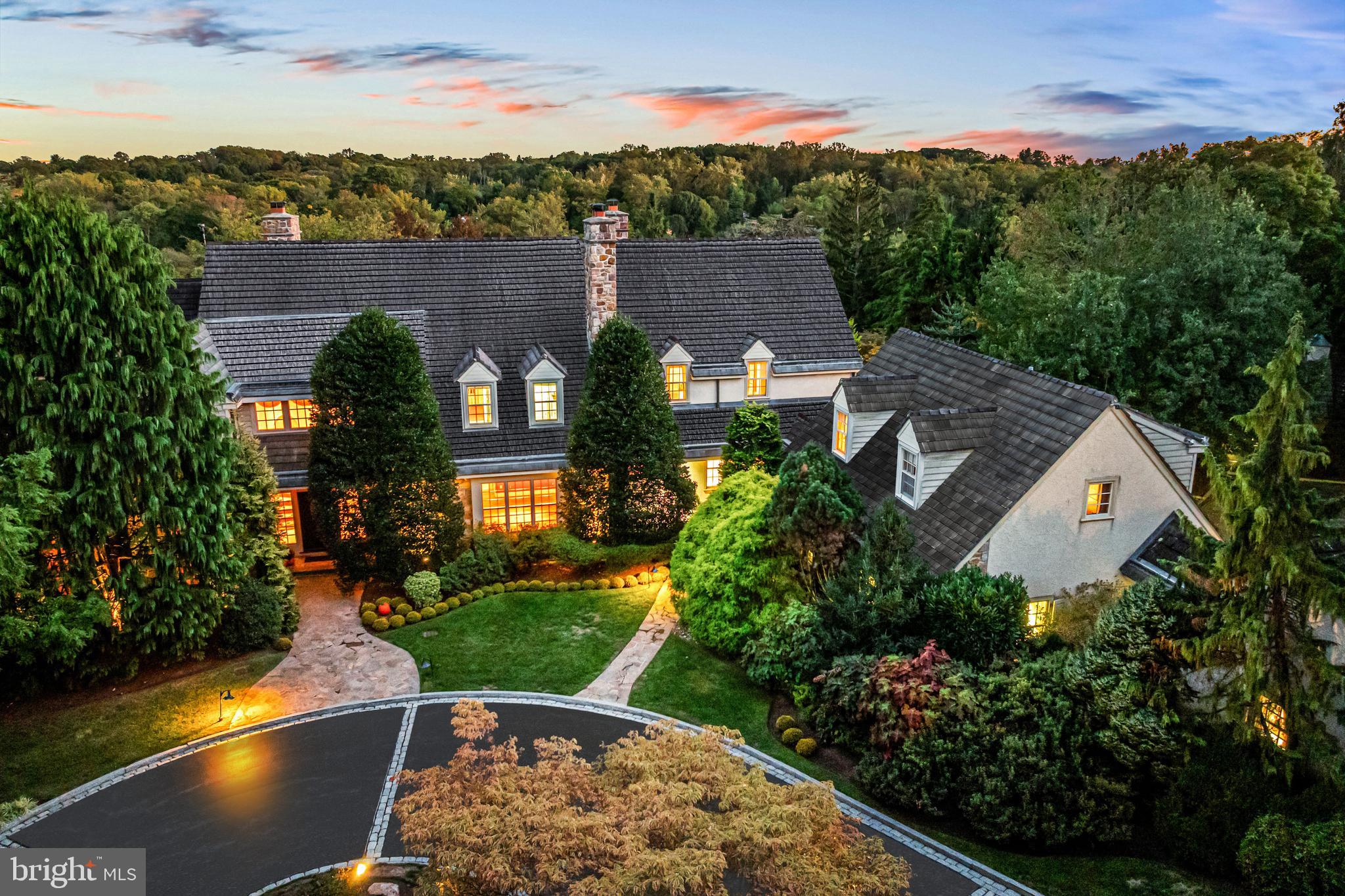 WOW!!! Seize the rare opportunity to own this spectacular property, available for the first time since it was beautifully designed and constructed in 1993, using only the finest materials for the main residence, 2 oversized 2-car garages and guest quarters. Set on 12.65 breathtaking acres with panoramic views on one of Gladwyne's most coveted streets, it offers unparalleled flexible interior and exterior spaces for gracious, flexible everyday living and grand entertaining with a timeless open flow and large bright windows doors, showcasing the expansive terraces, glorious gardens and pool. Endless features include high ceilings, beautiful site finished oak floors, fabulous living room with fireplace, inviting dining room, richly paneled library with fireplace and built-ins, expansive gourmet kitchen opening up to both a sunny breakfast room and dramatic family room fireplace and endless views of the grounds, spacious first floor guest suite and a convenient mudroom leading out to the garage courtyard and detached guest apartment. The sweeping main staircase and secondary staircases lead up to the spacious sun-filled second floor which offers a luxurious primary suite with stunning views of the lawn and specimen plantings, his and hers bathrooms and dressing room areas, 3 additional generous bedrooms with custom tiled full bathrooms and a generously sized laundry room with access to a staircase leading up to the third floor with a finished bonus room/ potential 5th bedroom. The thoughtfully flexible and timelessly created spaces continue throughout the walk-out lower level which services the privately located, award-winning designed Armond pool with a full bathroom, his and hers dressing areas, sauna and laundry, an expansive entertaining room with full bar/ kitchenette, fireplace, and game room / media space, Au Pair or In-law suite with full bathroom and lots of finished storage with walk-in safe. Additional structures include two oversized 2-car garages with charming guest house above one of the garages, including living and dining area, small kitchen, bedroom and full bathroom, and a separate gardening/ dog friendly building with powder room and storage capacity. This incredible oasis is a rare find along Philadelphia's suburban gold coast, close to Center City, all forms of transportation, renowned public and private schools and universities, endless clubs and recreational opportunities, Philadelphia International Airport, NYC and more!

** Note that the square footage does not include the living space in the guest house and the bedroom and bathroom count does not include the large bedroom and full bathroom in the guest house or the half bath in the utility building.

***With approximately 12.76 acres (+/-) the Property may be capable of being subdivided into additional lots. An initial conceptual yield plan was prepared that depicts a potential subdivision yield of up to three lots or units, including a lot with approximately 3.9 acres (+/-) fronting on Country Club Road to include the existing home and improvements. The yield plan shows the potential for up to two additional lots or units on the remaining land of approximately 8.8 acres (+/-) with frontage on Conshohocken State Road. An access and utility easement to benefit the property is of record providing for access to Conshohocken State Road over an existing bridge/driveway on the property at 701 Conshohocken State Road.