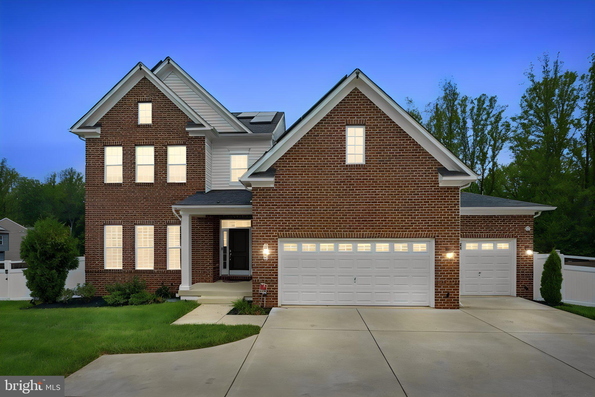Backing to a peaceful tree-lined setting in a sought-after Brandywine community, this exceptional 2021-built residence offers over 6,000 square feet of refined living space where luxury, privacy, and extraordinary outdoor entertaining take center stage. Beautifully designed outdoor living spaces unfold across multiple entertaining levels, featuring an expansive patio, custom paver gathering area with fire pit, integrated Sonos outdoor audio, professional landscape lighting, solar accent lighting, and a fully fenced backyard overlooking mature trees with no homes directly behind. Every outdoor space has been thoughtfully designed to create an exceptional setting for both intimate evenings and large-scale entertaining.

Inside, the thoughtfully designed open floor plan balances elegant entertaining with everyday comfort. The gourmet kitchen serves as the heart of the home, showcasing an oversized center island, Samsung appliances, double wall ovens, a gas cooktop, abundant cabinetry, and seamless flow into the inviting family room featuring custom built-ins, a fireplace, tray ceilings, and picturesque backyard views.

Offering six spacious bedrooms and five-and-a-half baths, the home provides exceptional flexibility across all three finished levels. A desirable main-level bedroom suite with a private full bath offers versatility for guests, while a mudroom enhances everyday organization.

The upper level is anchored by a luxurious primary retreat featuring tray ceilings, a private sitting area, two custom walk-in closets, and a spa-inspired bath complete with a freestanding  soaking tub and oversized shower with dual shower heads. Step outside to your own private balcony, creating a peaceful extension of the primary suite. An additional upstairs bedroom also features its own private ensuite bath, while two secondary bedrooms are connected by a convenient Jack-and-Jill bath. An upper-level laundry room and abundant storage further enhance the home's thoughtful design.

The walkout lower level was designed for entertaining, featuring a full wet bar, dedicated theater room, expansive recreation area, and a versatile sixth bedroom currently curated as a private fitness studio. This flexible space offers endless possibilities as a wellness retreat, guest space, hobby room, or additional bedroom.

Extensively enhanced with premium owner-selected upgrades, the home includes solar panels, custom blinds throughout, designer accent walls, a prewired speaker system serving six rooms, an in-ground irrigation system, a security alarm system, landscape and solar lighting, and countless custom improvements that elevate both style and functionality.

Completing the property are a spacious three-car garage, a private illuminated driveway, and access to neighborhood amenities including scenic walking trails, tranquil ponds, a community park, and a basketball court.

Ideally located with convenient access to shopping and dining at Brandywine Crossing, commuter routes including Routes 5 and 301, Joint Base Andrews, National Harbor, and Cedarville State Forest, this exceptional residence offers the perfect blend of luxury, convenience, and everyday livability.