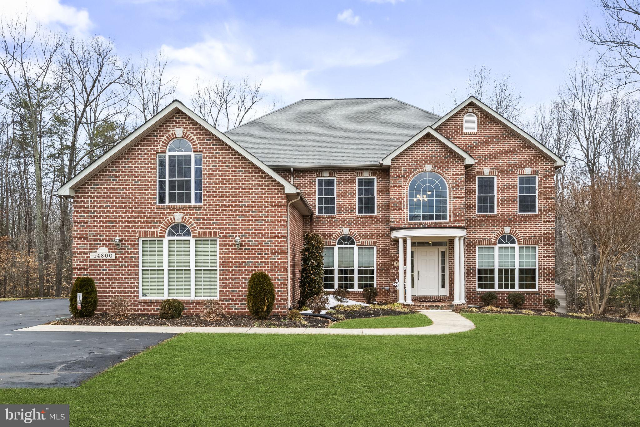 Large all-brick multigenerational home on over 3 private wooded acres with lake access in the sought-after Lake Jameson community. This freshly painted custom-built home (2005) offers over 6,905 square feet, 5 bedrooms, 5.5 bathrooms, and a three-car garage.

Designed with flexibility and space in mind, this home features a bright, open floor plan with a dramatic den showcasing 19-foot ceilings, a home office, formal dining room, gas fireplace, and walk-out access to a screened-in porch and deck. The spacious kitchen is ideal for entertaining and everyday living, offering a large walk-in pantry, oversized island, two sinks, coffee/wine bar, and stainless steel appliances. A large mudroom with washer/dryer and private side entrance adds convenience.

A standout feature is the main-level handicap-accessible bedroom and full bathroom, providing an ideal setup for multigenerational living, in-law accommodations, aging in place, or long-term guests.
The upper level offers four bedrooms and a versatile loft area. The expansive primary suite features tray ceilings, a spa-like bathroom with oversized dual-head shower, and an exceptionally large walk-in closet rarely found in homes of this size.

The finished walk-out basement provides outstanding additional living space, including large recreation areas, private multimedia room, full bathroom, flex room (currently used as a 6th bedroom), kitchenette, and extensive storage.

Enjoy the privacy of over 3 wooded acres with abundant outdoor space, including a backyard fire pit — perfect for relaxing or entertaining.

Additional highlights include a backup generator for peace of mind.

Lake Jameson is a private, pet-friendly lake community known for its wooded lake, scenic trails, and natural surroundings. Convenient commuter location with access to Routes 5, 301, and 231. Ideally positioned for military relocation with proximity to Joint Base Andrews, Pax River Naval Air Station, and Coast Guard Headquarters.

Homes in Lake Jameson are rarely available. Schedule your showing today.