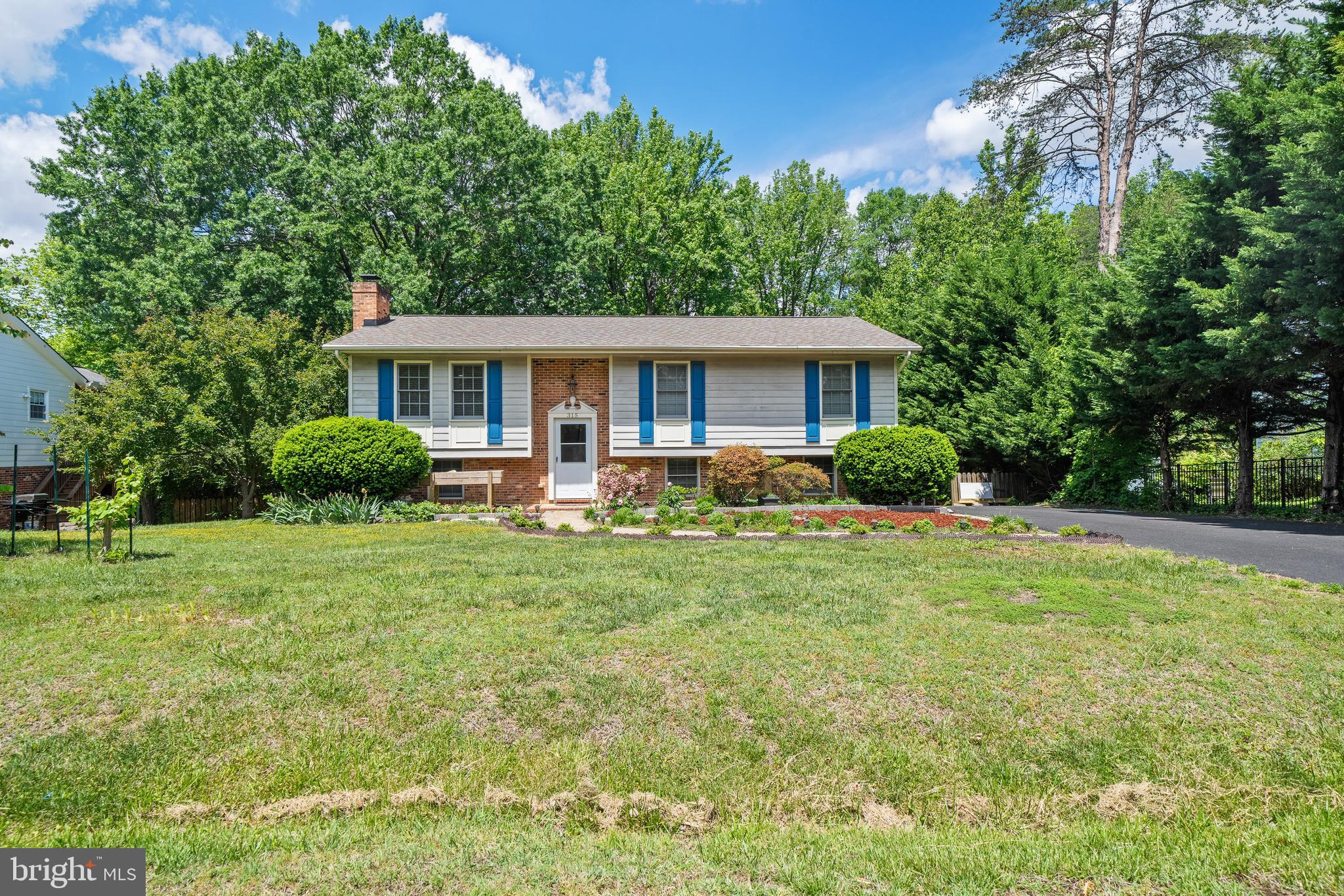 This adorable split level home in sought after Spotswood Estates is ready to welcome its new owner(s) to the neighborhood. Total  kitchen remodeling 2021, New insulation 2022, New driveway 2023, Duct Clean 2024, New AC 2024, New stove range 2025. The primary bedroom with attached bath and 2 more nicely-sized bedrooms plus hall bath reside on the main living level. The main level has an airy and light-filled open floor plan with an upgraded kitchen, dining area and living room. Stepping onto the large deck from the dining area, a staircase leads you out into the backyard .The lower level has a brick fireplace and family room as well as a built in bar area. An organized workshop and storage area along with a large bedroom suite and half bath round out this charming home. Downtown Fredericksburg is minutes away. NO HOA