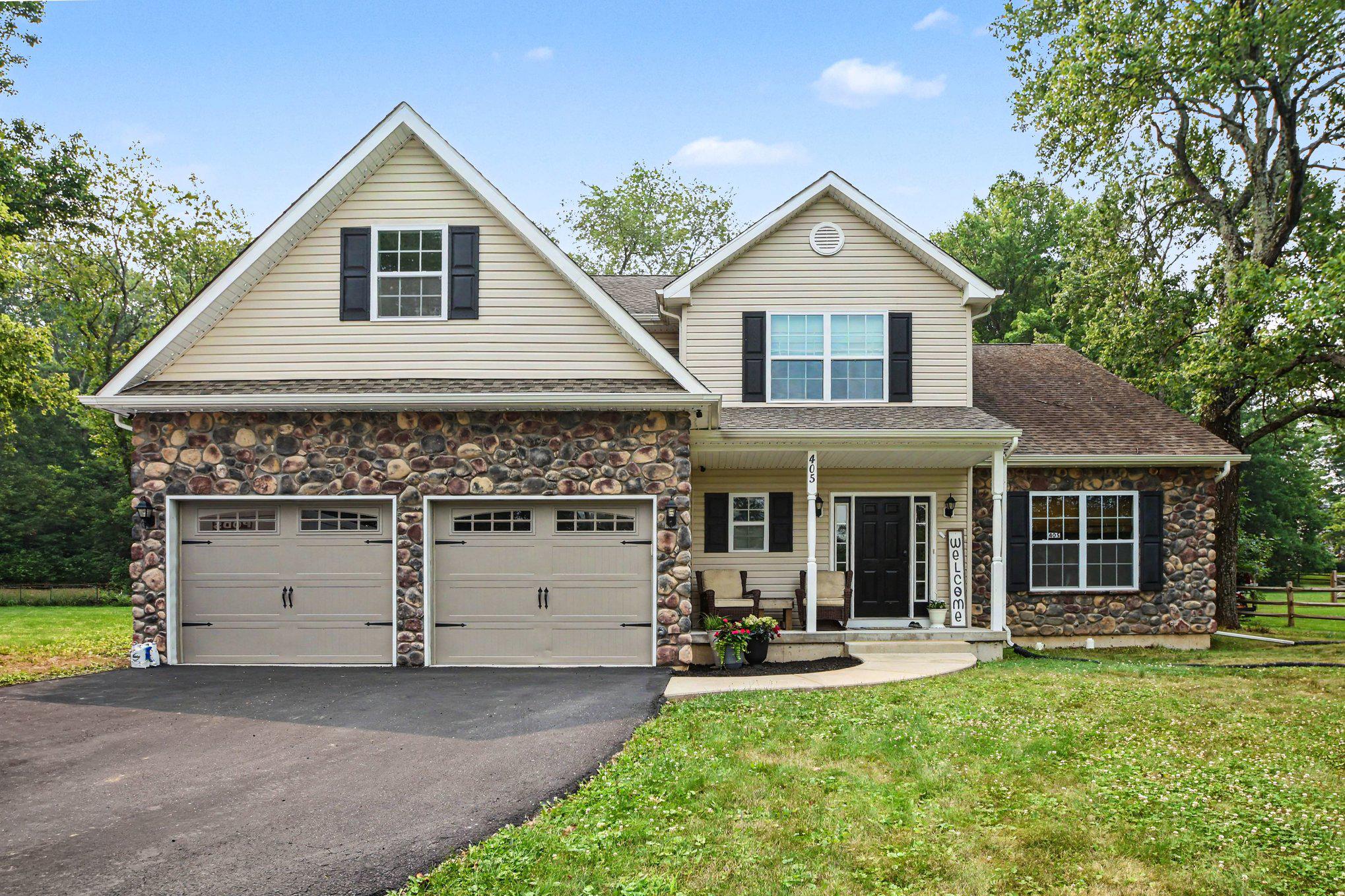 Welcome to 405 Three Mile Run Rd! This beautiful Colonial offers an ideal combination of comfort, functionality, and entertaining space. The inviting exterior features a charming front porch with stone and vinyl siding, a two-car garage, and a welcoming entrance.
Step inside to find a thoughtfully designed first floor featuring newly installed luxury vinyl wood flooring, a spacious living room with vaulted ceiling, and an adjacent dining room perfect for gatherings. The kitchen opens to a cozy family room complete with a gas fireplace, creating the perfect space for everyday living and entertaining. A convenient first-floor laundry room with access to the garage and a powder room complete the main level.
The second floor offers four spacious bedrooms, including a private primary suite featuring a walk-in closet and an ensuite bathroom. A hall full bathroom provides additional convenience for family and guests. All Bedroom closets have custom built in organizing systems!
The finished basement adds even more living space with a built-in bar, comfortable sitting area for watching TV, dedicated gym space, additional storage, and a fun rock-climbing wall creating a unique recreation area for all ages.
Enjoy outdoor entertaining on the large deck with a mounted TV setup ready for your own outdoor entertainment experience. The fenced-in backyard includes a shed for additional storage and provides a great space for relaxing, entertaining, and enjoying the outdoors.
Located in the desirable Pennridge School District, this well-maintained Colonial offers the perfect blend of indoor and outdoor living with spacious rooms, modern updates, and versatile living spaces throughout. Don’t miss the opportunity to make this exceptional home your own!