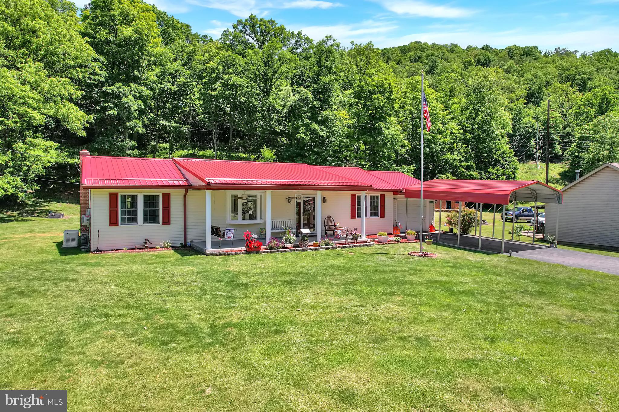 Welcome home to this beautifully renovated ranch-style property offering amazing mountain views, a huge yard, and the added benefit of no city taxes! Featuring 3 bedrooms and 2 full baths, this home has been thoughtfully updated from top to bottom and is truly move-in ready.  Step inside and fall in love with the fresh, modern feel throughout. The kitchen features brand-new granite countertops, while the entire home showcases new laminate plank flooring for a clean and updated look. The metal roof adds lasting value and peace of mind.  The basement has been freshly painted and sealed with new flooring, making it the perfect blank canvas for future living space, a recreation room, home office, gym, or additional storage. With plenty of storage space already available, this home offers both function and flexibility.  Outside, the newly landscaped exterior creates beautiful curb appeal, while the spacious rear yard is ideal for family fun, gardening, pets, and outdoor entertaining. Enjoy relaxing evenings on the rear patio, plant your favorite vegetables in the garden area, or cool off in the above-ground pool, which is negotiable. The property also includes a one-car garage and a large one-car carport for added convenience.  Perfectly located close to Keyser, WV and Frostburg, MD, this home offers easy access to restaurants, shopping, medical facilities, and everyday conveniences while still giving you the peaceful setting and space you’ve been looking for.  This pristine home has been beautifully maintained and completely renovated so all you need to do is pack your bags and move right in. Don’t miss your chance to own this charming rancher with updates, views, outdoor living, and a wonderful location all in one. This home shows "Pride Of Homeownership"!  Call today to schedule your private tour!