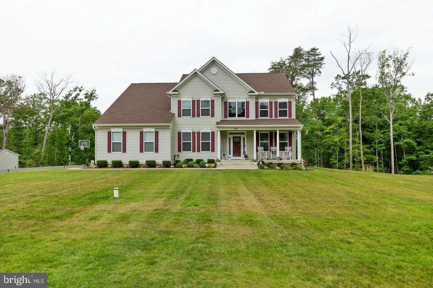 Grand living in Brooke Point Estates! This spectacular home peacefully tucked away on a sprawling 1.5-acre lot backing to woods in Stafford, VA offers a perfect blend of luxury, space, and convenience to enjoy. With over 4,900 square feet of interior layout, this home has 3 beautifully finished levels with an abundance of appealing designs and upgrades. Enter the home to a dramatic 2-story foyer and the welcoming main level featuring a large office-study; artfully designed living, dining, and family rooms; and a dream gourmet kitchen with upgraded stainless steel appliances, center island, granite, and 42” wood cabinets. The upper level features a grand primary room with walk-in closets and a spa-like bath with a soaking tub, separate shower, and ceramic tile. 3 more sizable bedrooms grace the upper level to include a private full bath in one, and another full bath in the hallway. Retreat to the huge finished basement with a walk-up exit to the rear yard, a completed recreation room, full bath, ample storage, and space to build out a media/fitness room or a 5th bedroom. Relax in the fresh air on the front porch after work or on a weekend morning. Additional pleasures: Well water and includes a whole home water filtration system (no water bill); lawn irrigation system on the front, sides, and rear; alarm system; 2-car garage with auto-openers and extended driveway for 8+ cars; Ring Doorbell; wainscoting, main-level laundry, iron riser stair rails. HOA includes trash service. Electricity is on the nearby hospital grid. Conveniently located very close to the VRE, I-95, RT 1, Embrey Mill Town Center, dining, recreation, and the future downtown Stafford Smart City. More to see and experience. Shows immaculate! See virtual video tour in the listing.