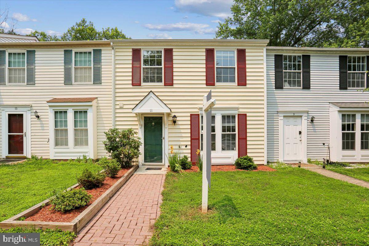 UPDATED TOWNHOUSE IN WOOTTON HS CLUSTER 
Don’t miss out on this exceptional updated 2BR, 1.5 BA townhouse on a quiet cul-de-sac in Dufief Mill Estates, featuring all hardwood floors on both levels (redone 2010) and fully fenced backyard with fabulous brick patio! Enter into this Wootton HS cluster home to find a modern first floor powder room; updated kitchen with maple wood cabinets, all white appliances including newer LG fridge (2021), and pass through with eat-in bar; and first-floor laundry with newer washer/dryer (2022) and convenient first floor HVAC and hot water heater (2019) tucked away in closet. The spacious open living/dining room features an elegant corner wood-burning fireplace and French doors (2017) to a fully fenced and gated backyard with brick patio and flowering trees. Upstairs, two spacious bedrooms sharing a bright and updated full bathroom with black and white tile flooring, bathtub with shower, and spacious linen closet. Bedroom number one is the primary suite with hardwood floors, ceiling fan, double wide closet, and ensuite entrance to the bathroom. The second bedroom with ceiling fan, spacious closet and updated paint also shares access to the full bath through a hallway brightly lit with a unique skylight. This home is an excellent value in highly coveted Dufief Mill Estates, with two unassigned parking spaces, plentiful walking trails, recreation spaces, playgrounds and tot lots, and easy access to all the best of North Potomac, Kentlands, Travilah area shopping, Rio, Fallsgrove, I-270 and 495, and ride-on buses to Metro.