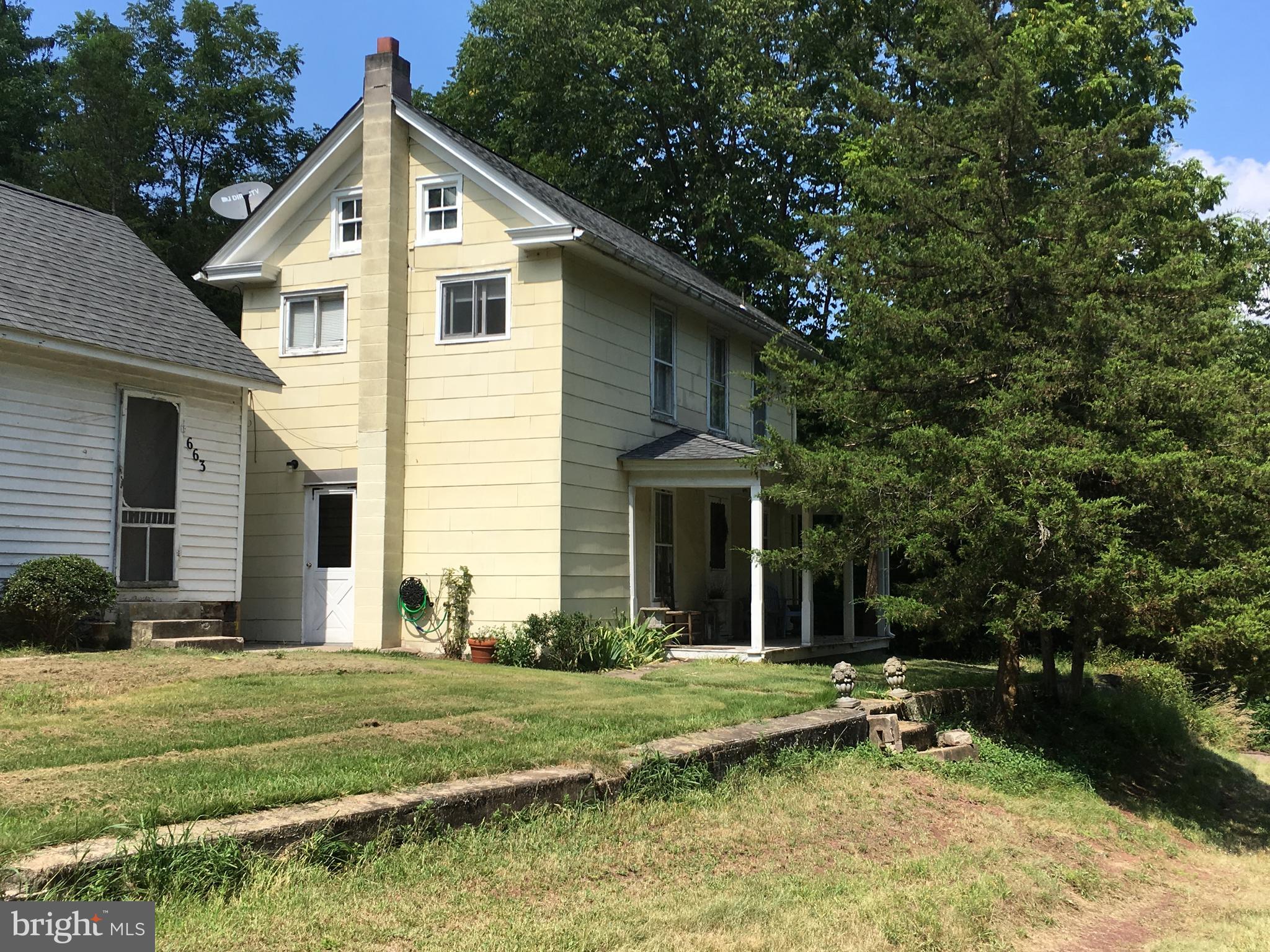 A charming two-bedroom, one-bath home in Kintnersville sitting on 0.78 acres offering plenty of authentic details. The home was originally built in the late 1800s. Step inside to the beamed ceiling Living Room with hardwood floors and a non-working fireplace. The eat-in Kitchen has a new stove and built-in microwave. The 2nd floor has two Bedrooms and one Full-Size Bath. A large landing at the top of the stairs could be used as a reading nook or work space. The property has two Outbuildings. The Summer Kitchen from yesteryear has shiplap walls, beamed ceiling and a free standing wood-burning stove, could be used for Office space or an Art Studio. Pull your car into the one car garage or use it for storage. The washer and dryer are in the basement. Located on a country road in the award winning Palisades School District. Minutes away from New Jersey but still close to everything Bucks County has to offer!